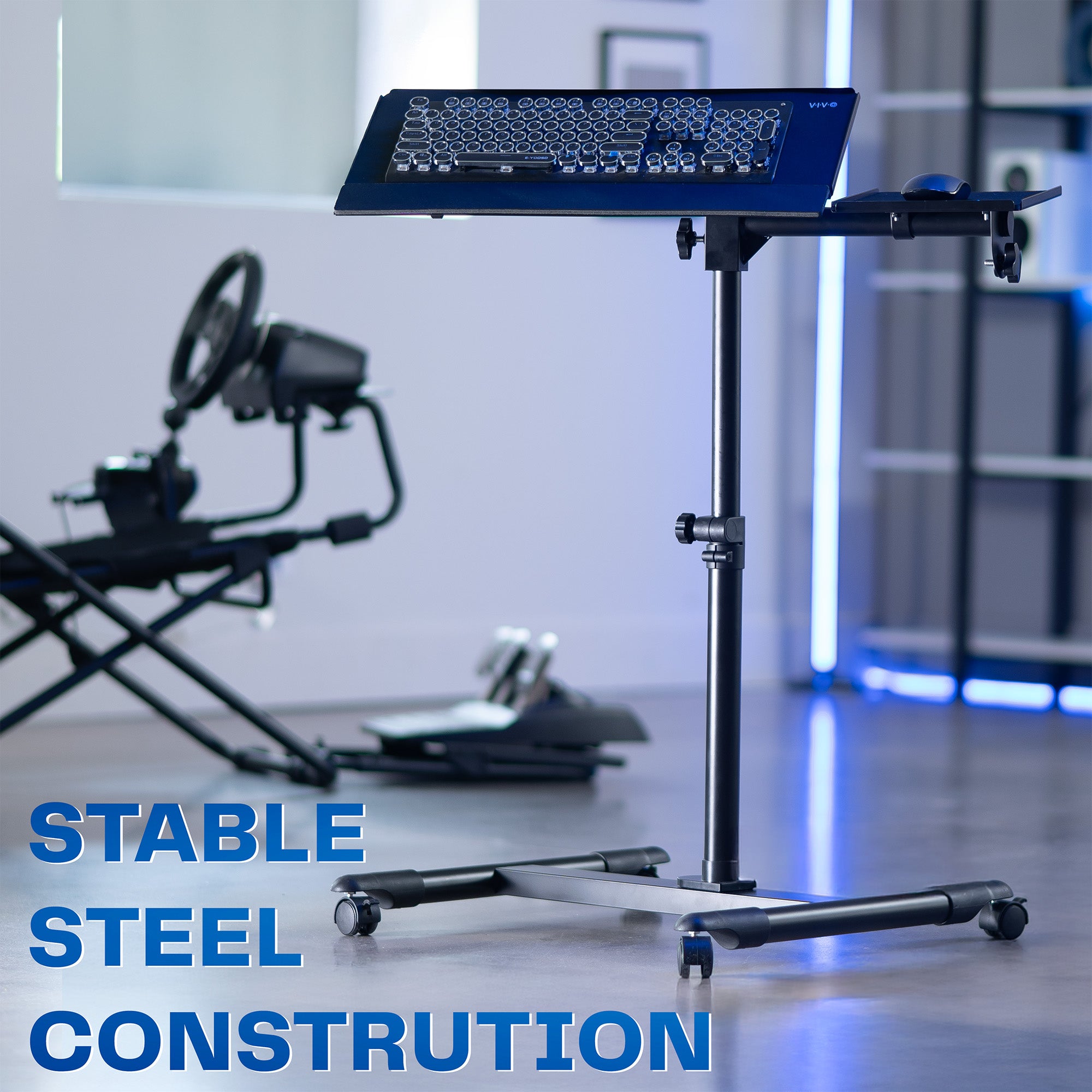 Laptop stand with adjustable height in a room with gaming equipment