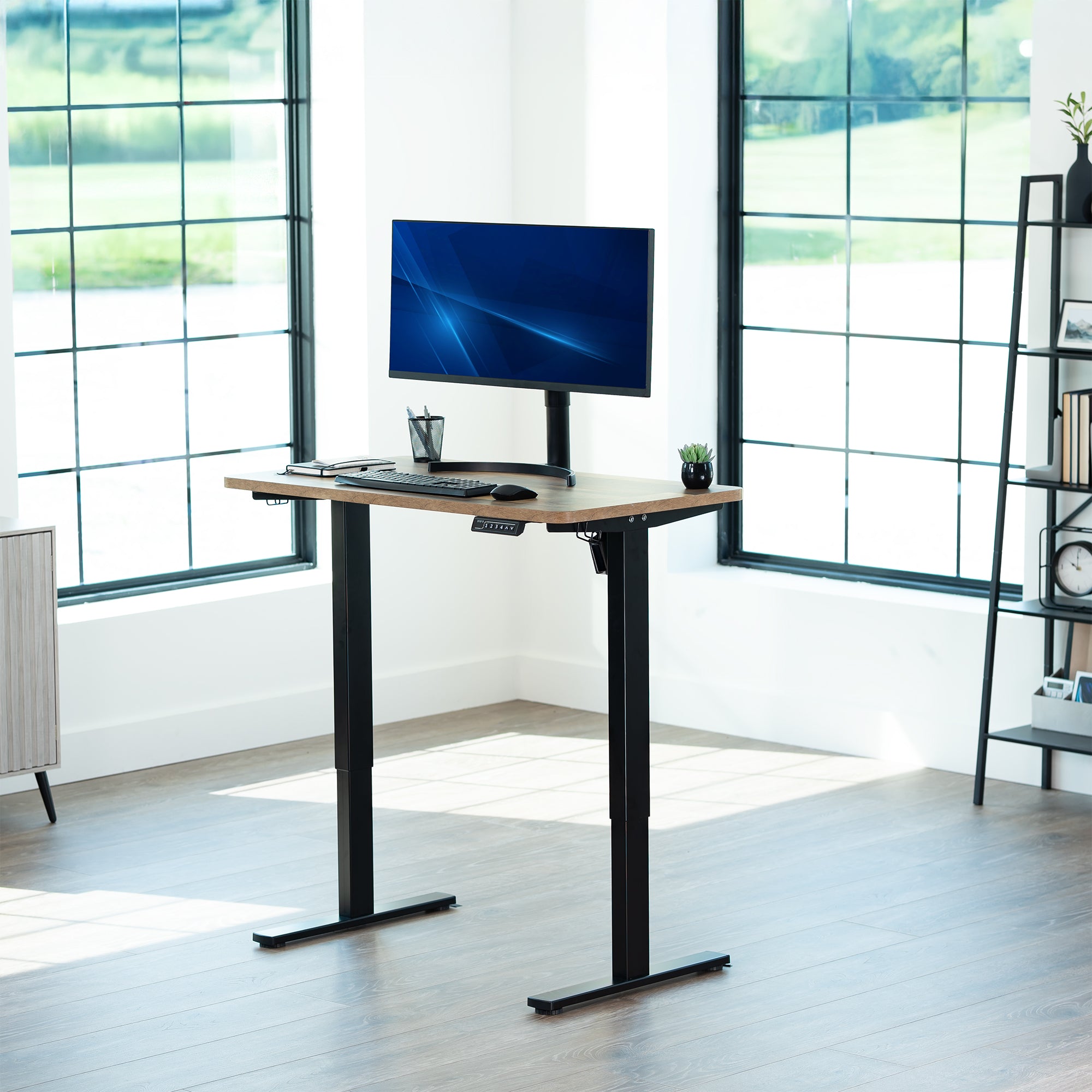 Sturdy ergonomic sit or stand active desk workstation with adjustable height using smart control panel.