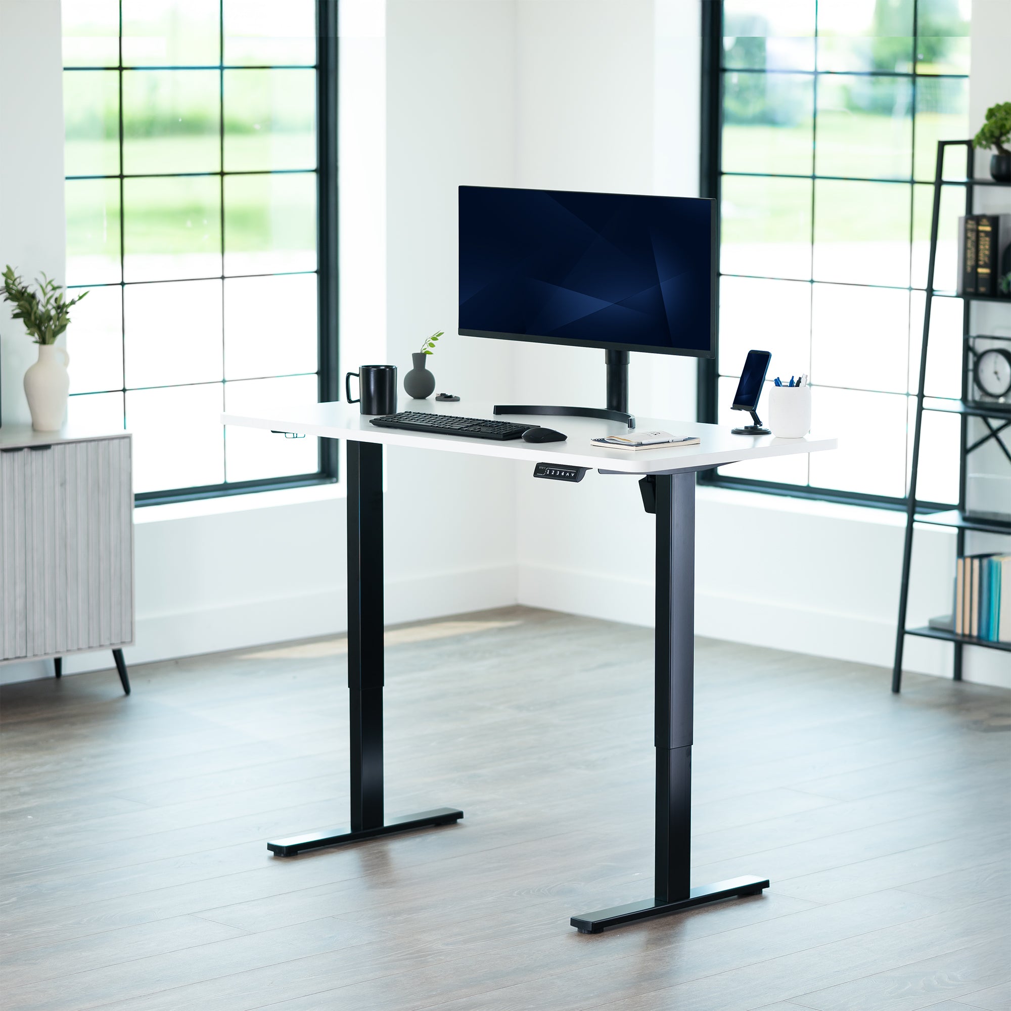 Sturdy ergonomic sit or stand active desk workstation with adjustable height using smart control panel.