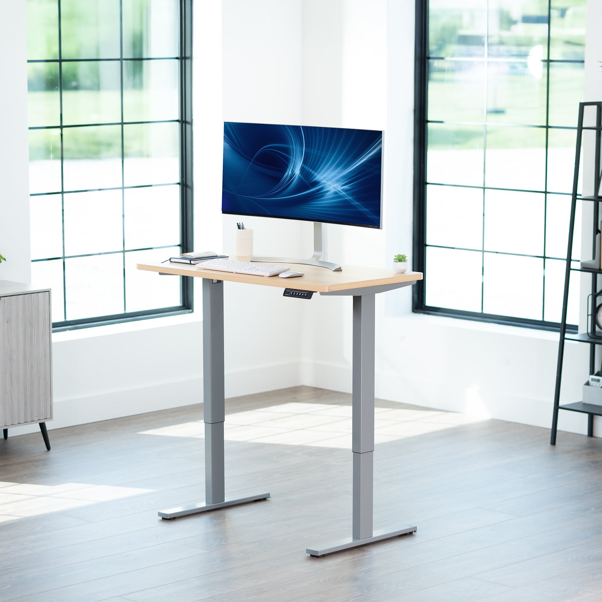 Sturdy ergonomic sit or stand active desk workstation with adjustable height using smart control panel.