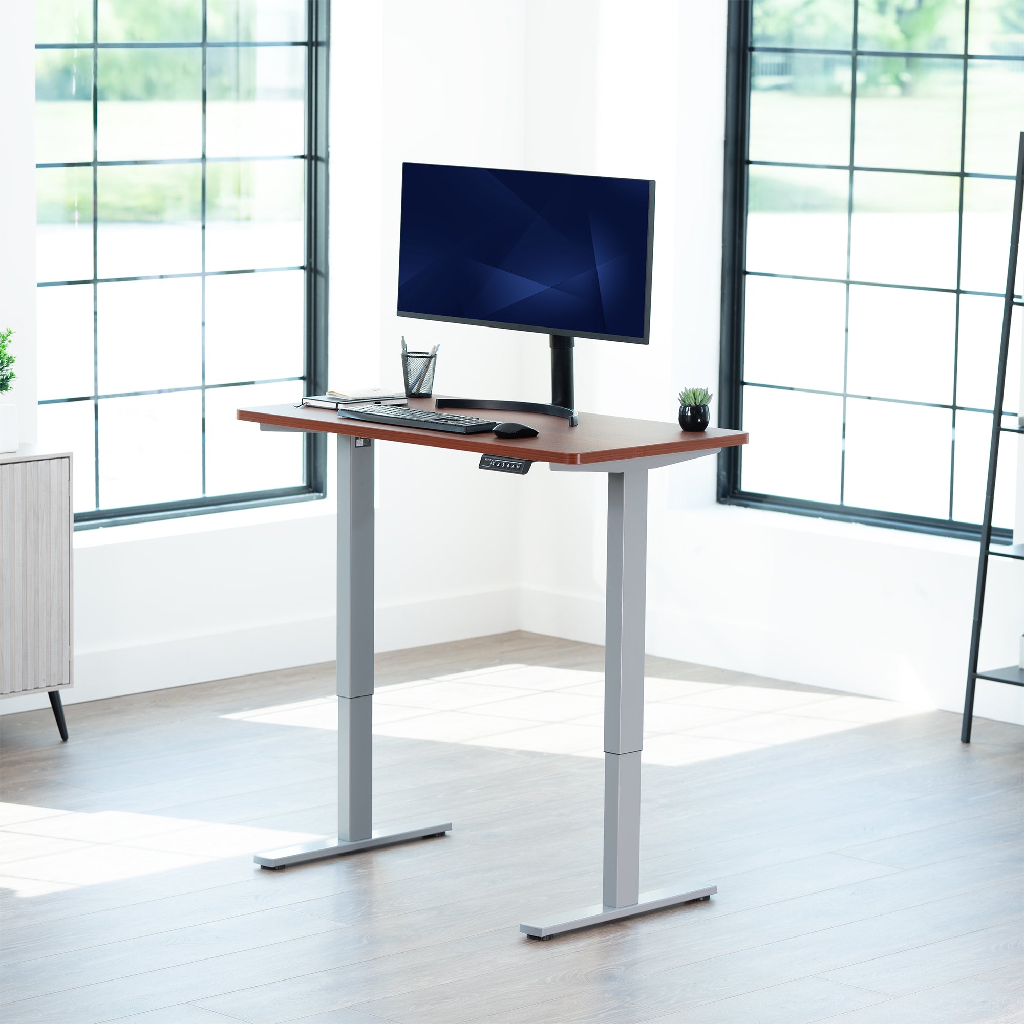 Sturdy ergonomic sit or stand active desk workstation with adjustable height using smart control panel.