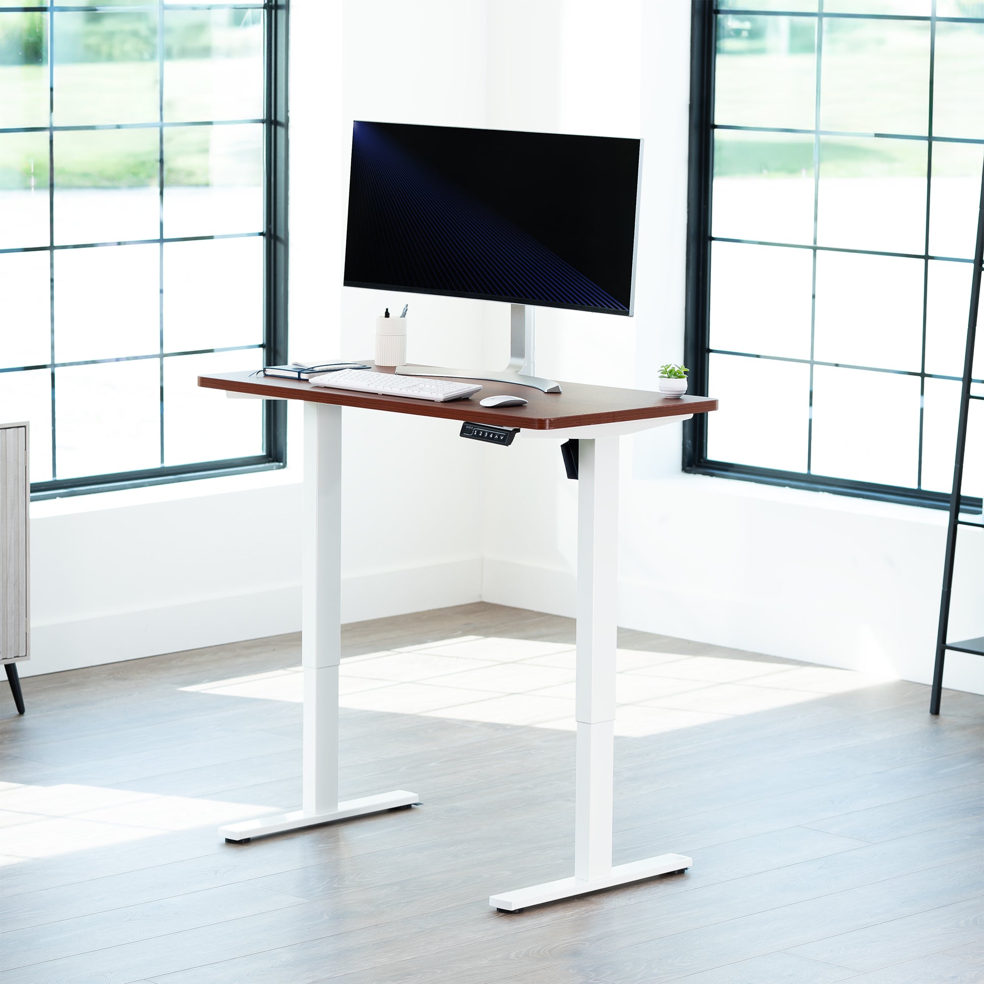 Sturdy ergonomic sit or stand active desk workstation with adjustable height using smart control panel.