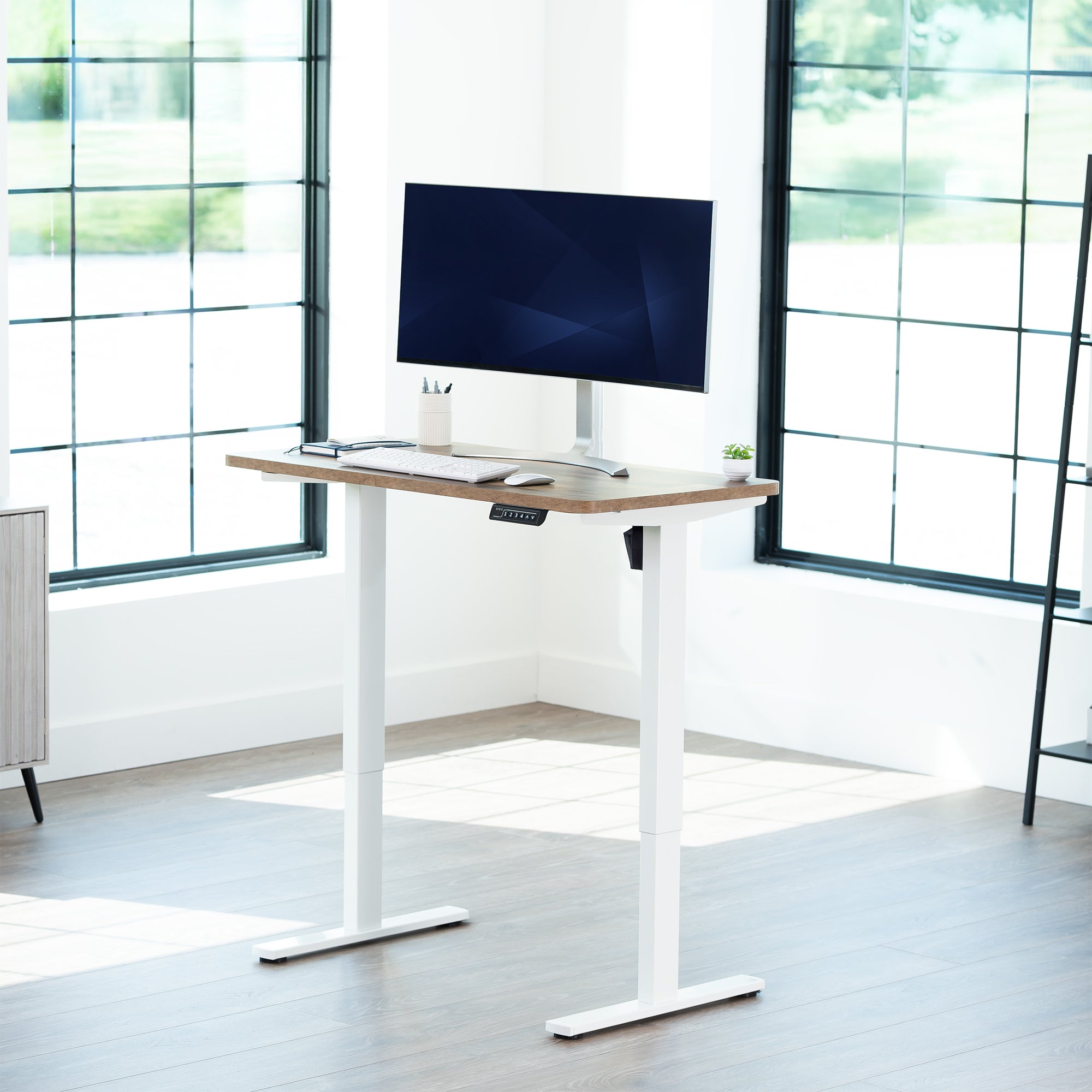 Sturdy ergonomic sit or stand active desk workstation with adjustable height using smart control panel.