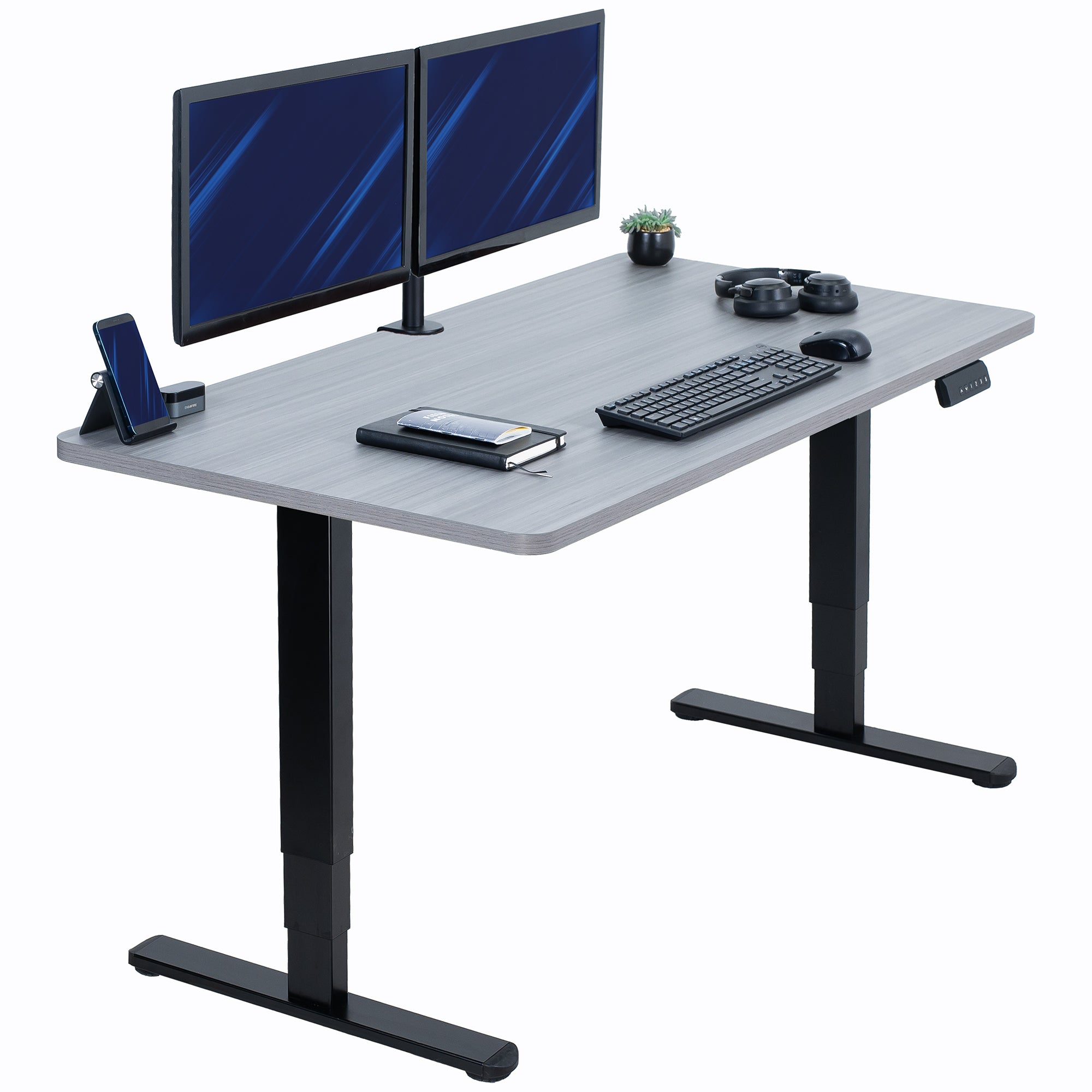 Gray desk with black legs, two monitors, keyboard, mouse, and phone on a white background