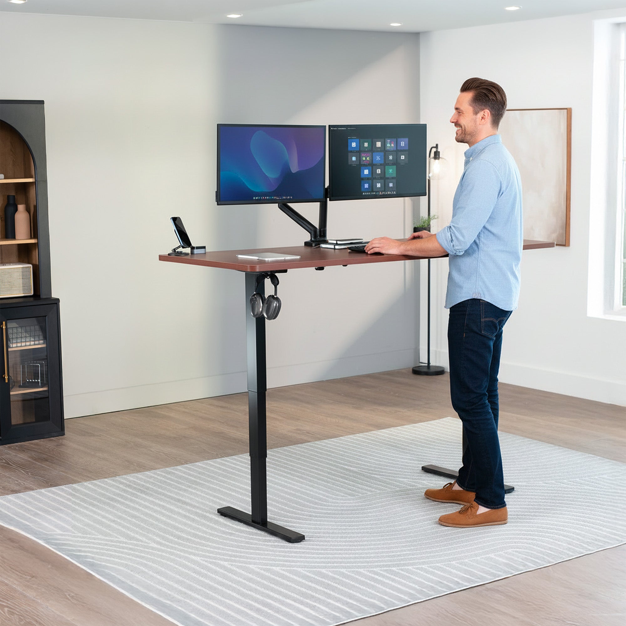 Man Standing at Dark Walnut Desktop 2E Series - 71" x 30" Electric Desk with Touch Screen Memory Controller