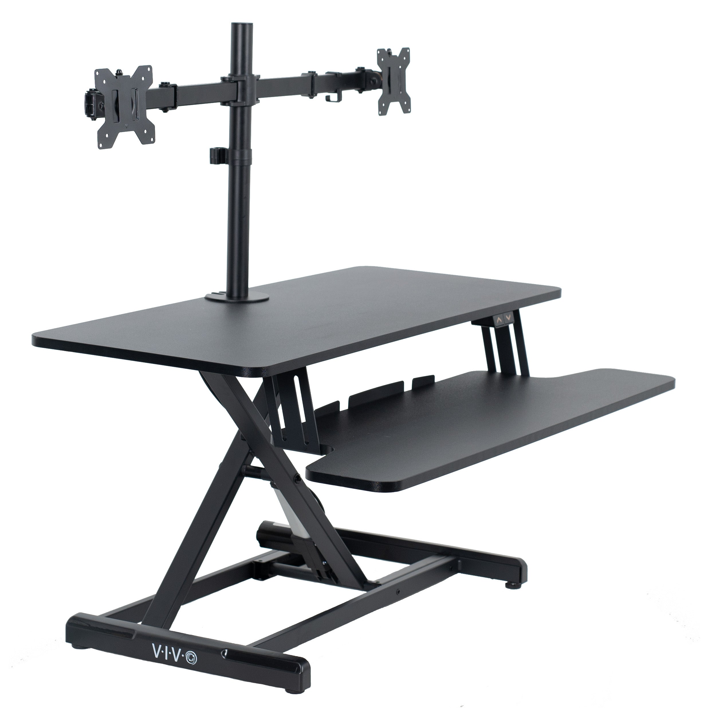 Sit to stand desk riser and dual monitor mount with electric height adjustment.