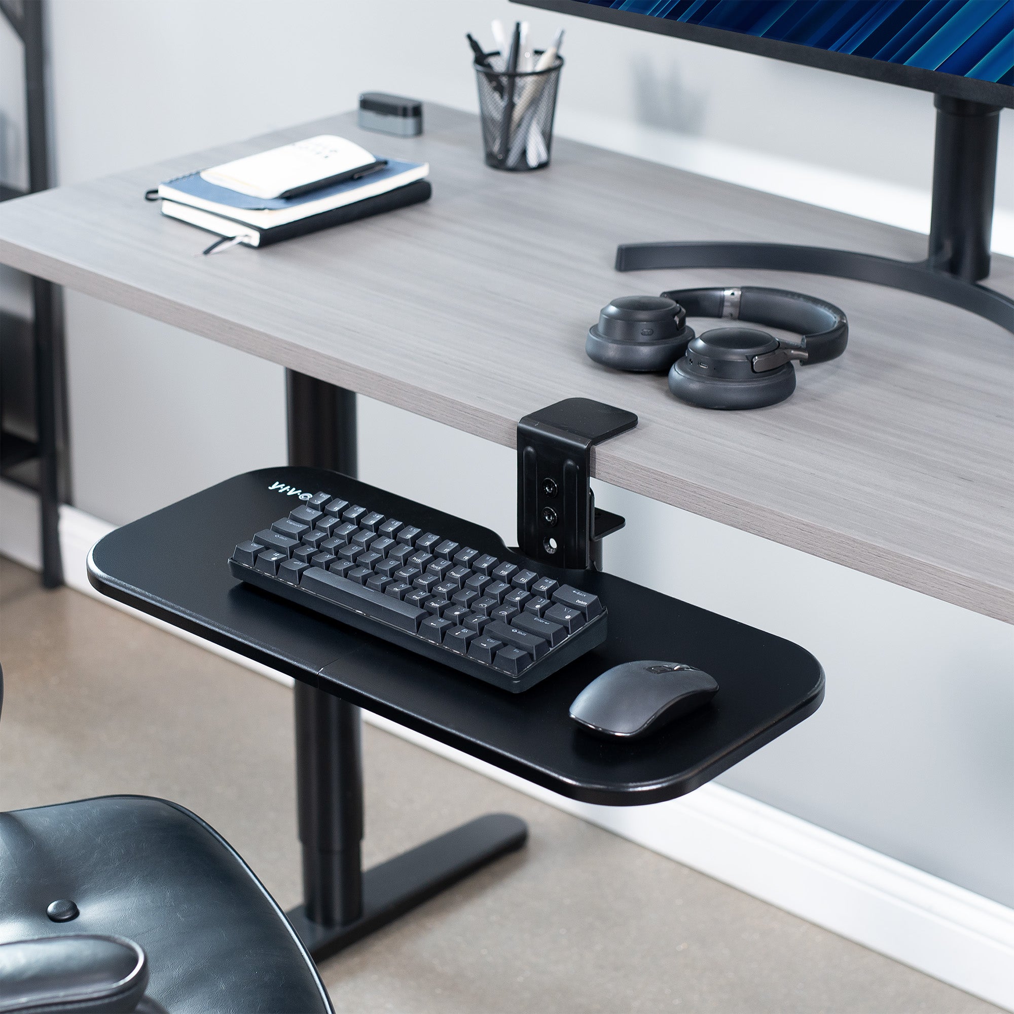 Single Clamp Rotating Keyboard Tray in a modern office.