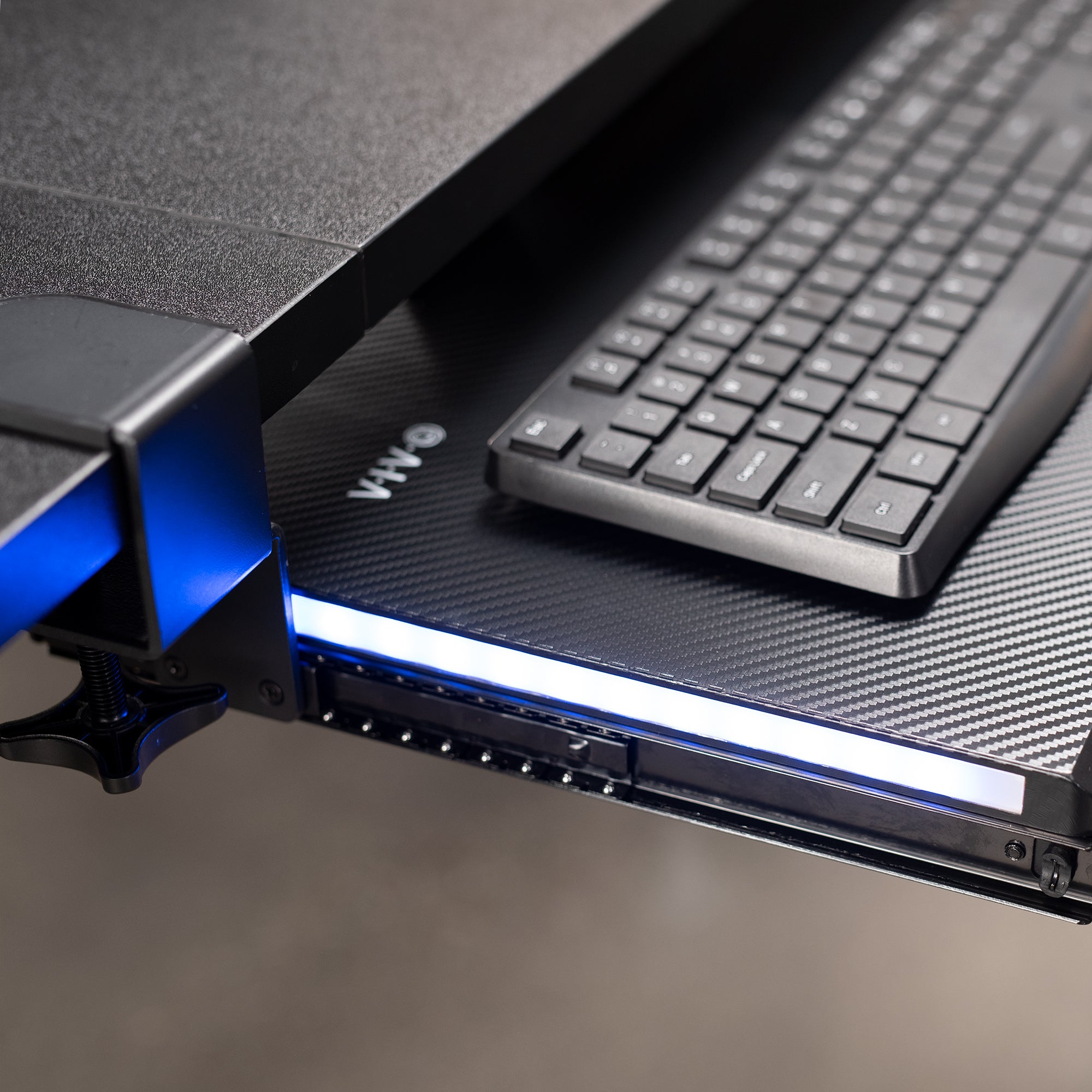 Clamp-on desk keyboard tray with RGB side lights.