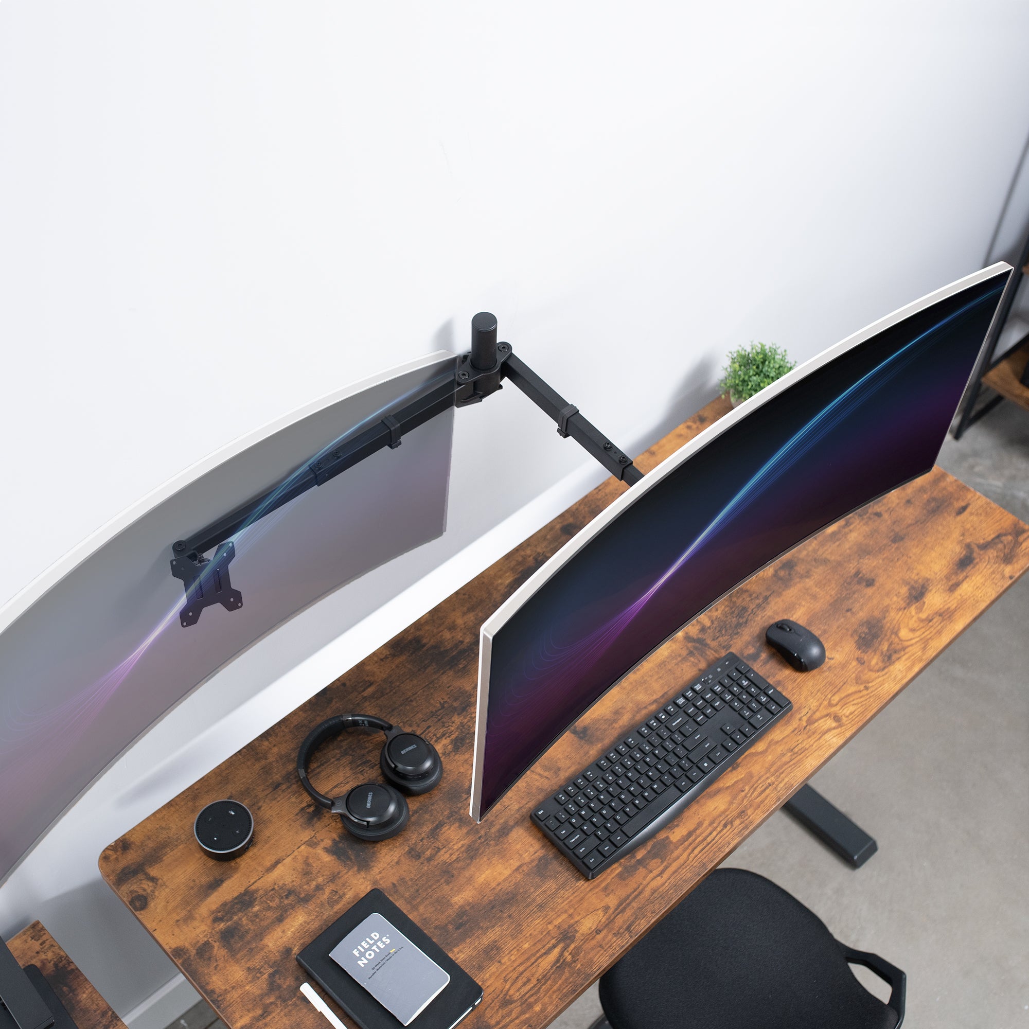 Telescoping dual monitor wall mount.