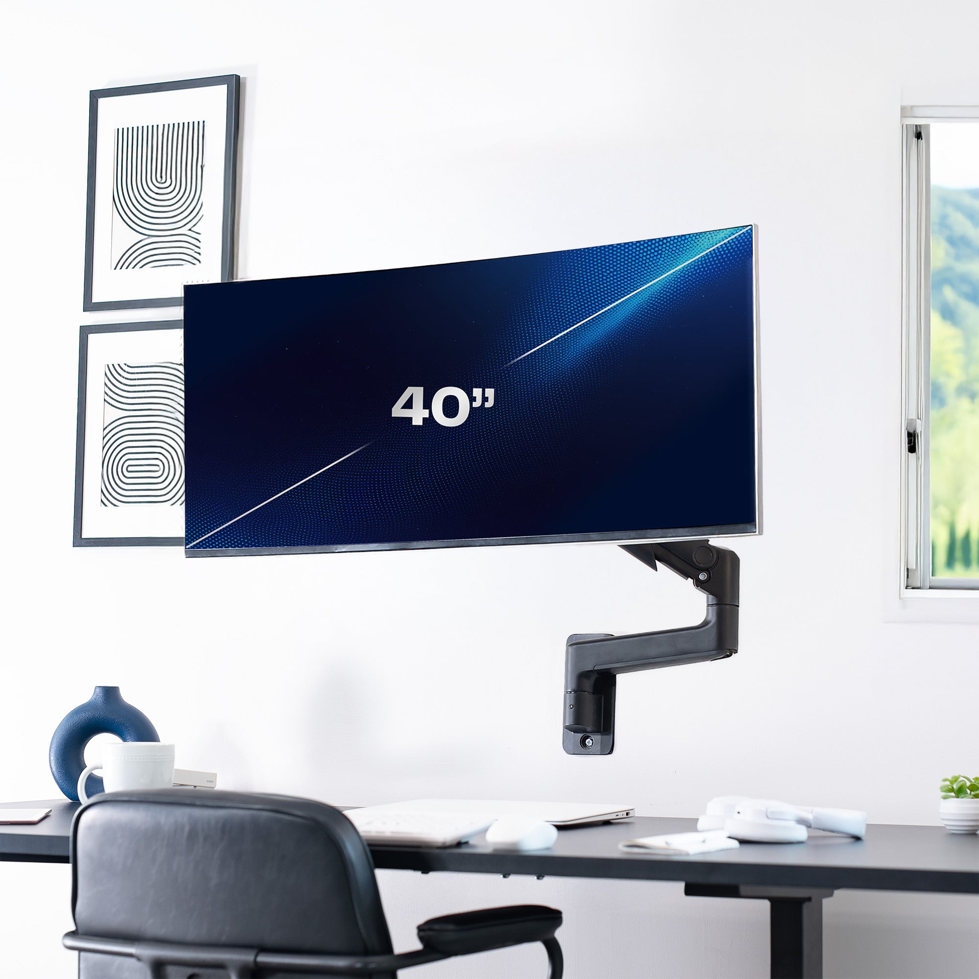 Mechanical Arm Single Ultrawide Monitor Wall Mount in office setting.