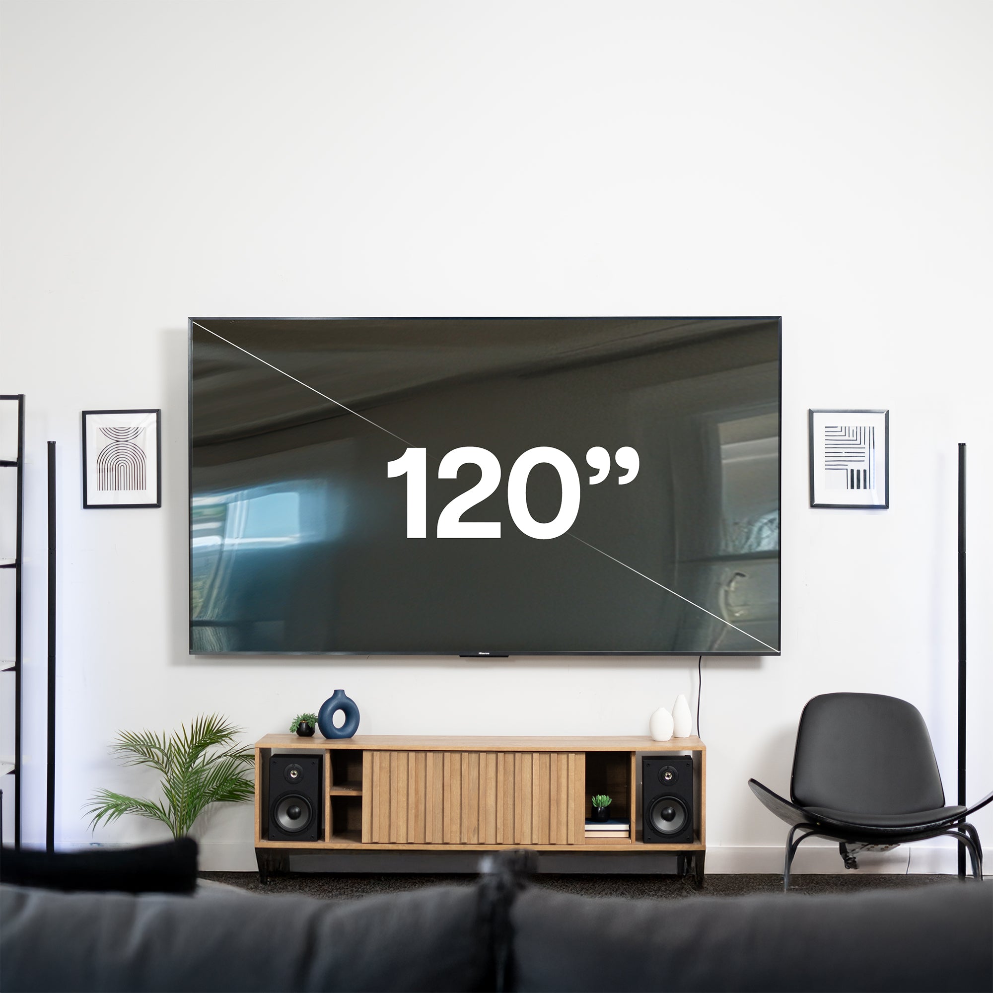 A black TV wall mount with a labeled screen size indicating the maximum size it can support.