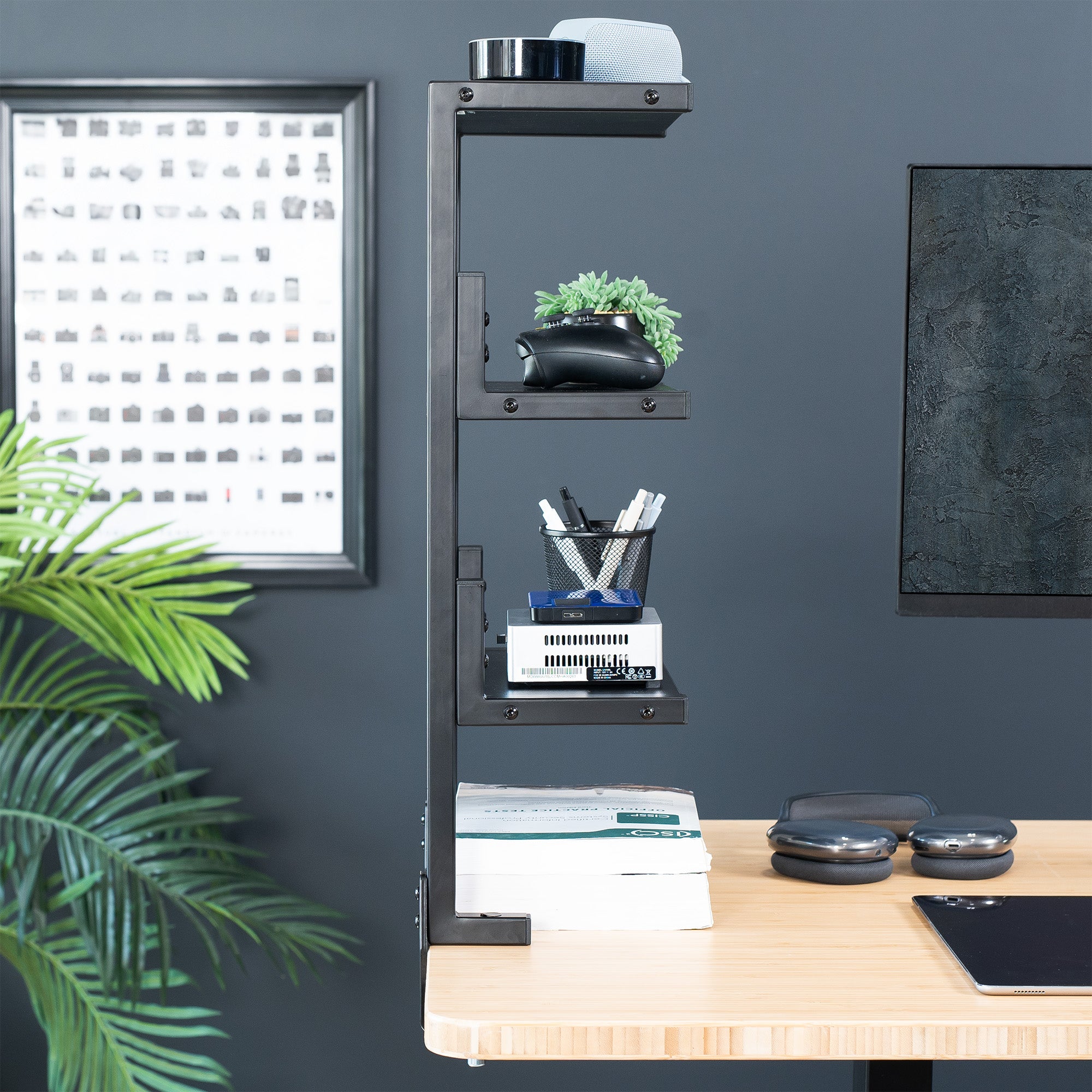 A black 13-inch clamp-on 3-tier shelving unit for desks in a modern home office.