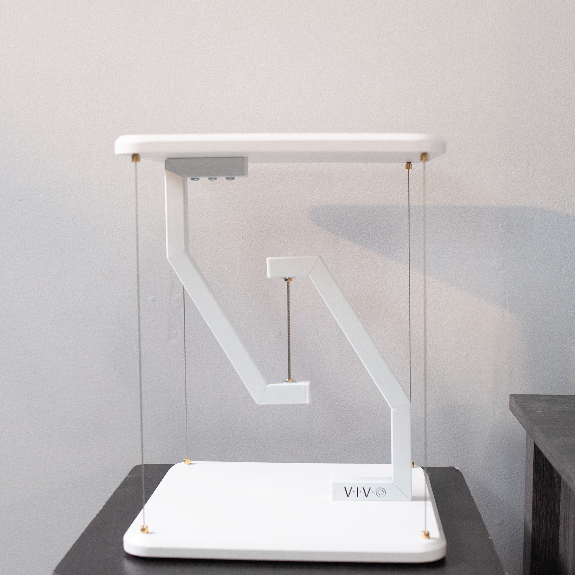 Floating speakers stand for improved sound and aesthetic appeal.