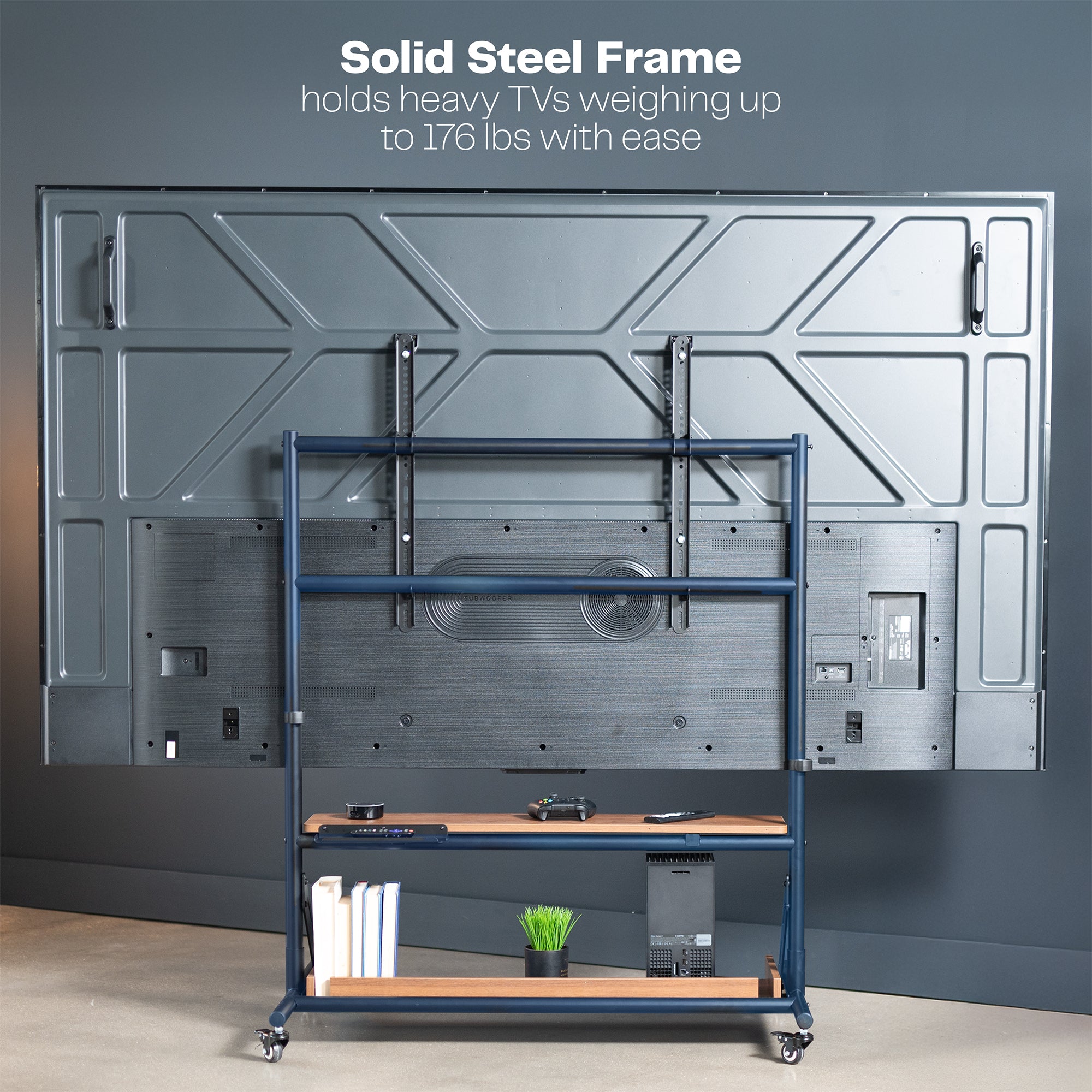 A heavy duty TV cart with dark wood shelves, featuring a black metal frame and four caster wheels.