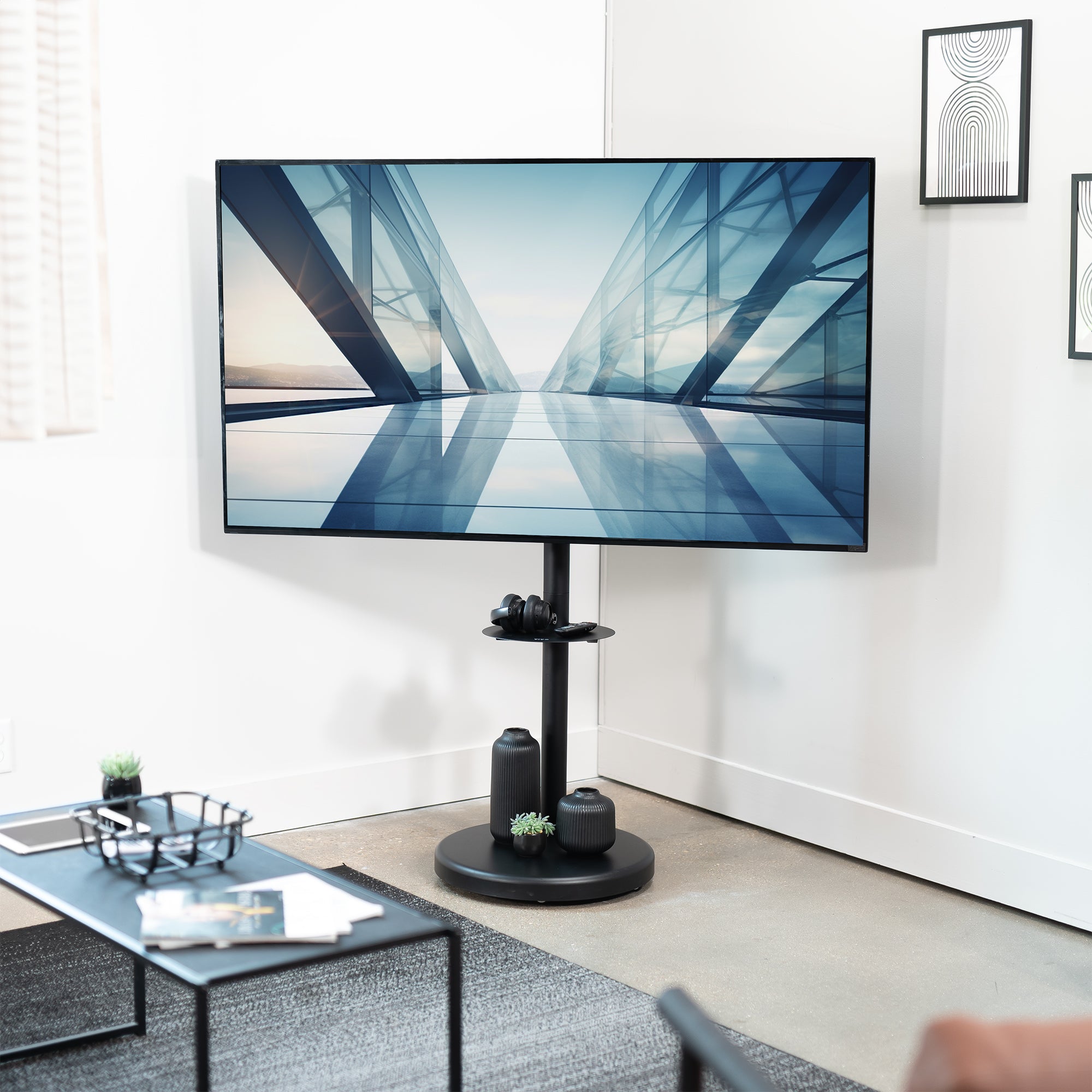 Mobile TV stand with shelf featuring height adjustment, tilt, swivel, rotation, and built-in cable management.