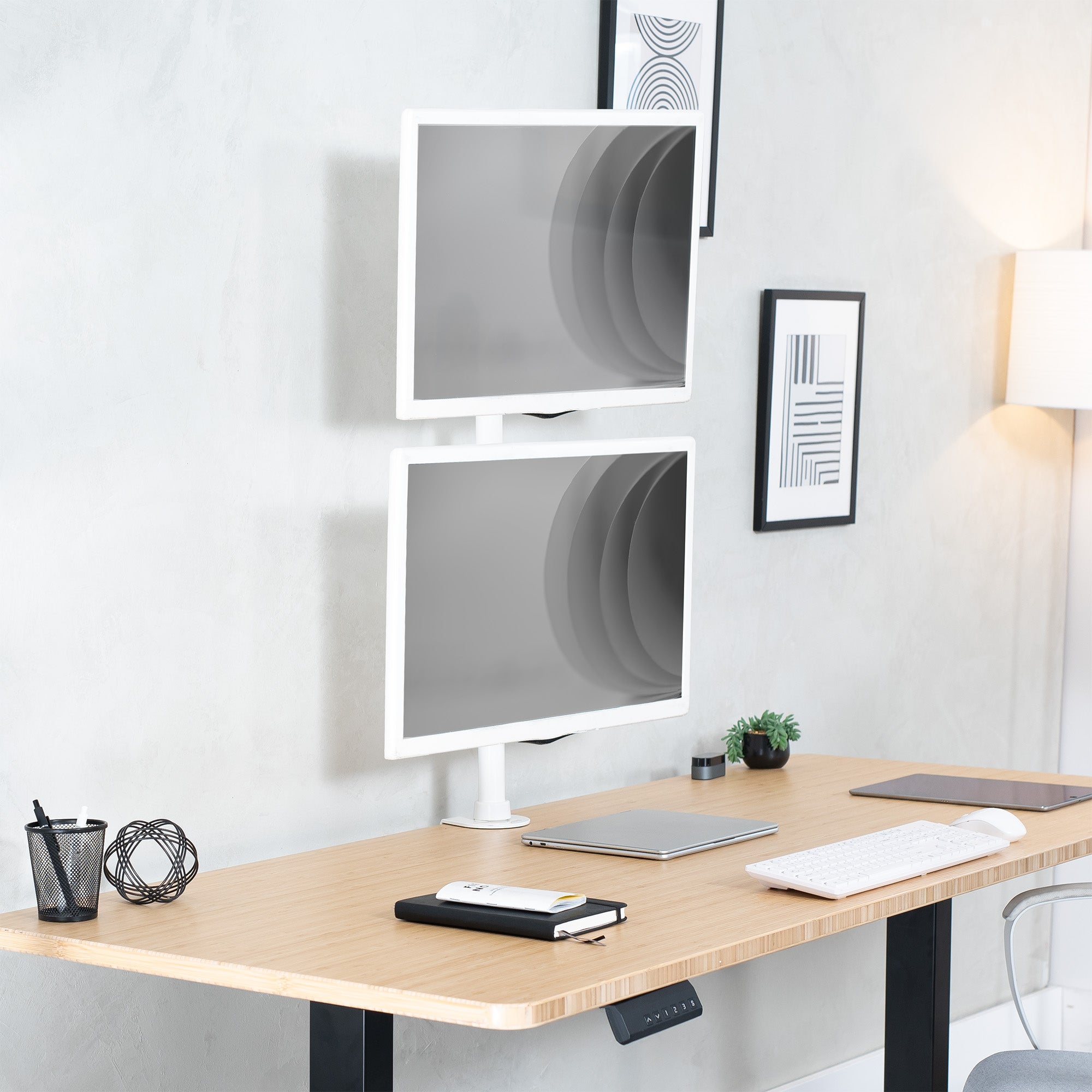 Sturdy adjustable vertical dual monitor ergonomic desk mount for office workstation.