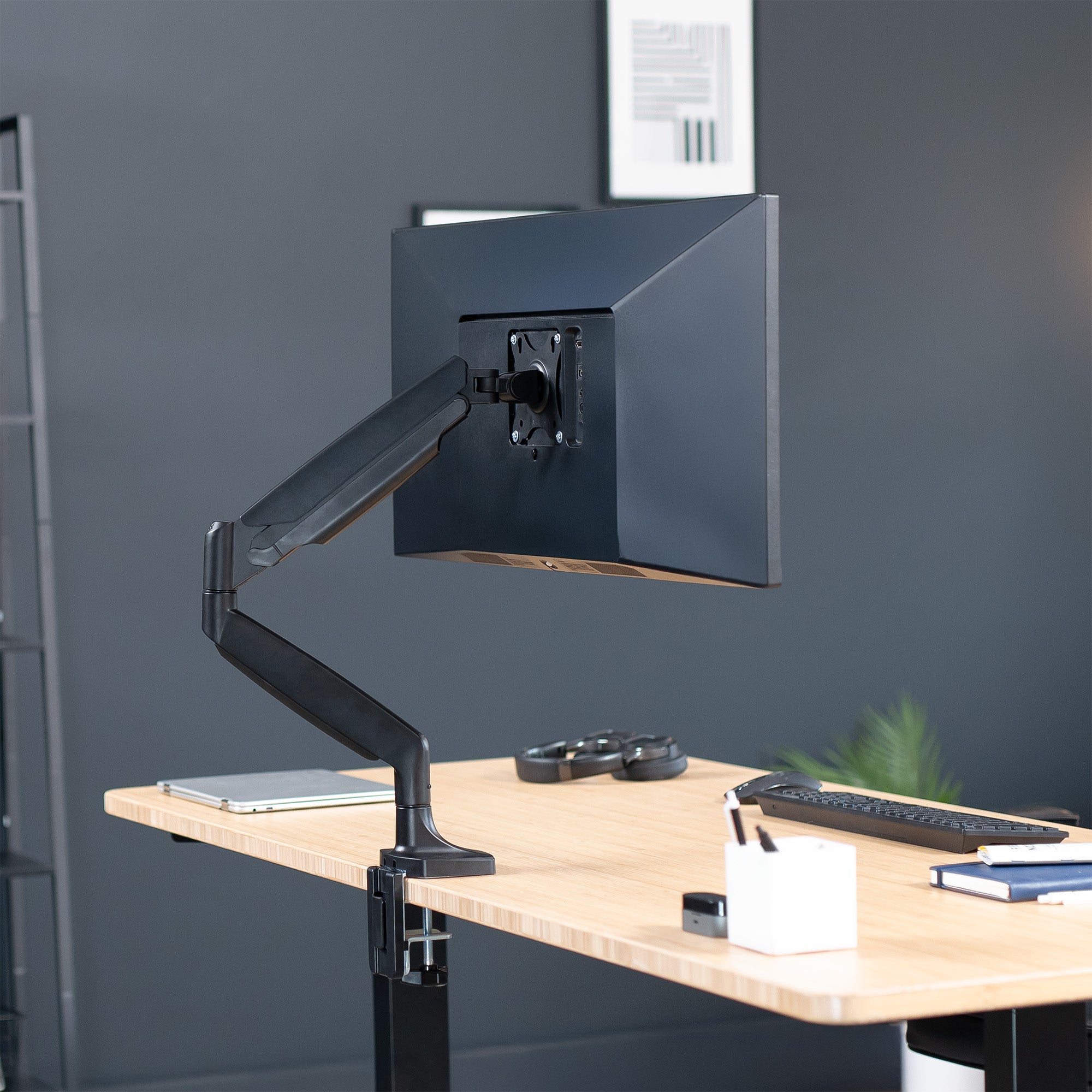 Single ultrawide monitor desk mount arm with a black finish.