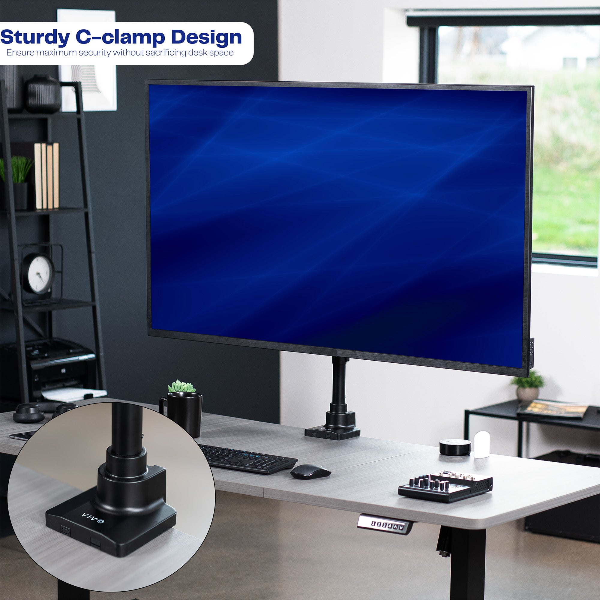 Low profile TV desk mount with articulating arm with cable management.