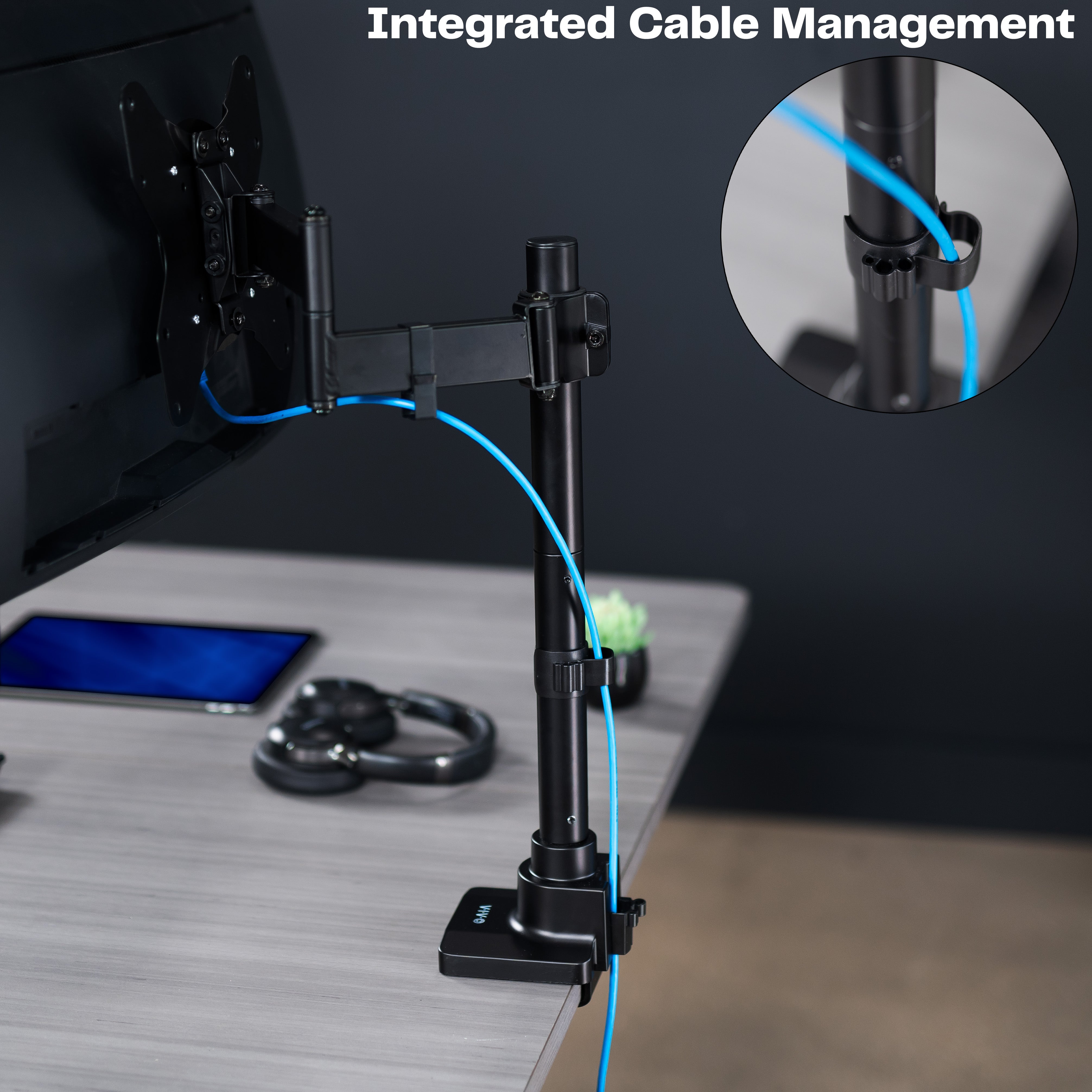 Low profile TV desk mount with articulating arm with cable management.