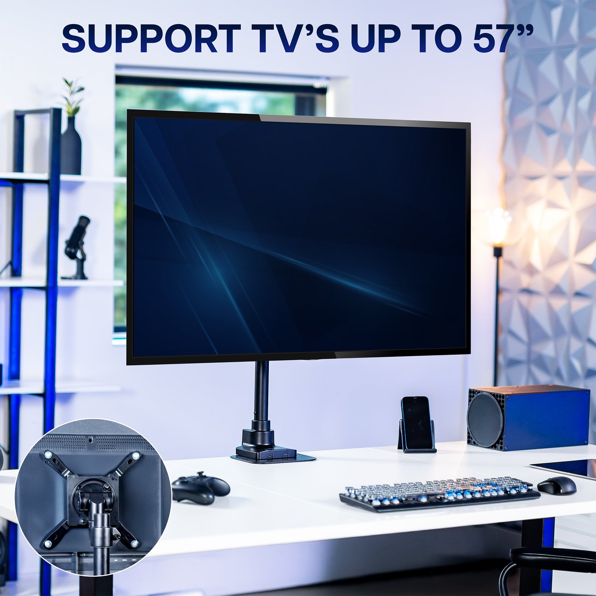Monitor stand with a monitor on a desk in a room setting, highlighting TV support