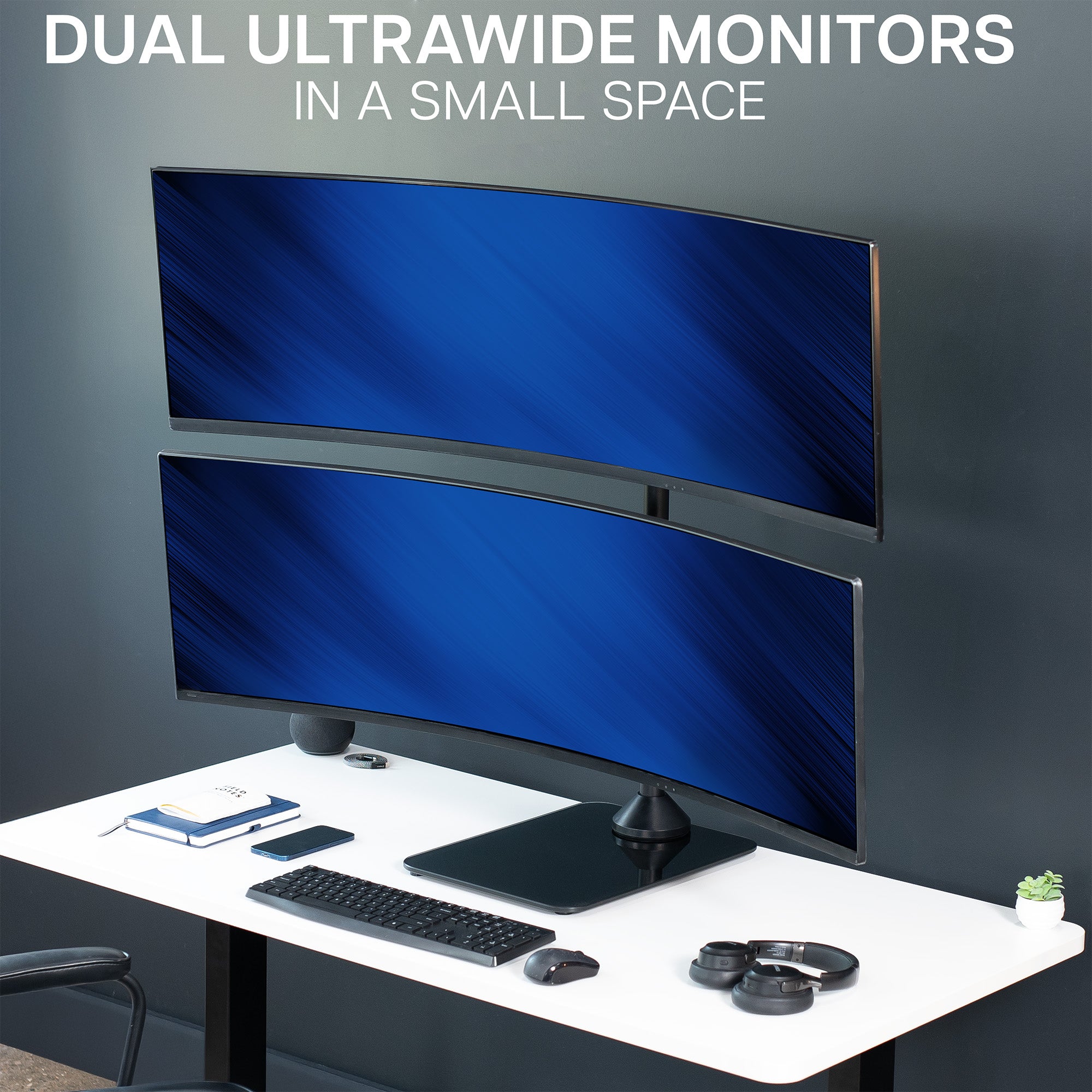 Two ultrawide monitors on a desk with a dark gray wall background