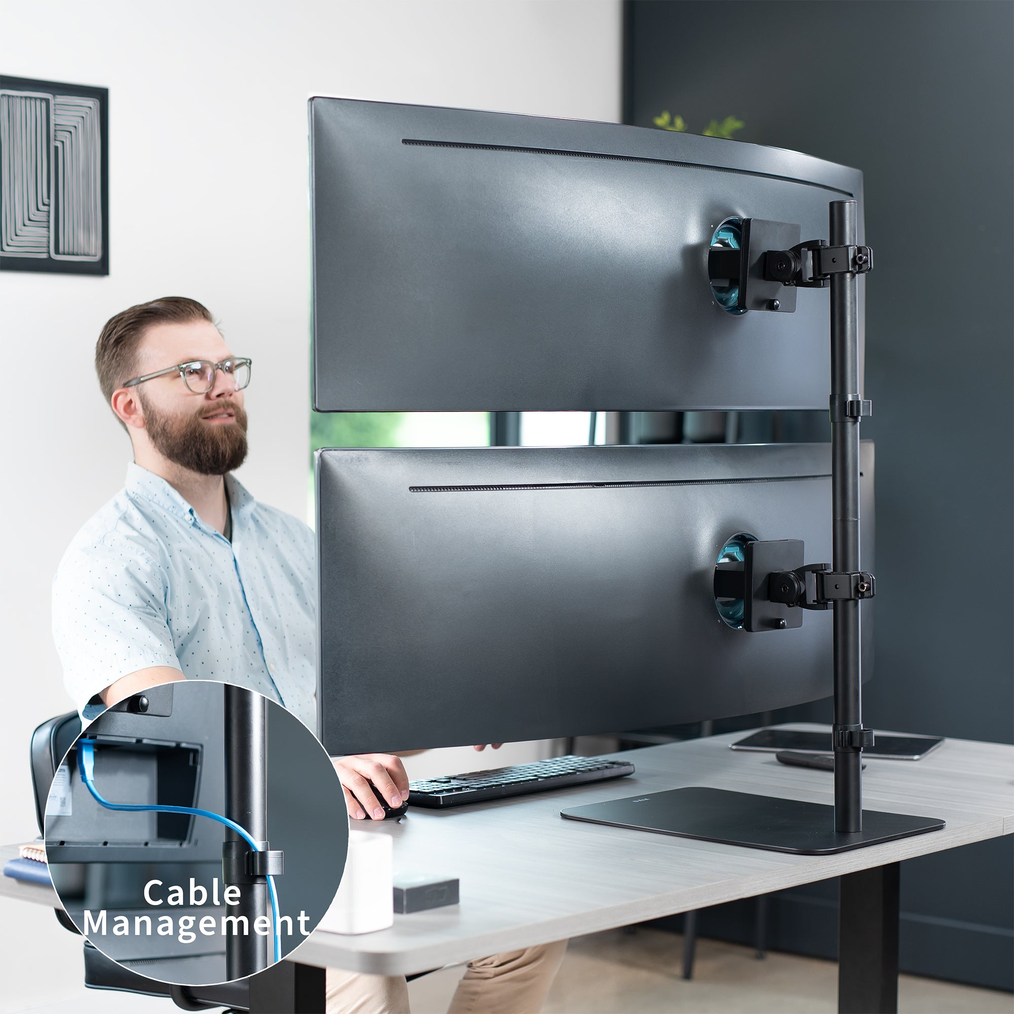 Dual Ultrawide Vertical Monitor Desk Stand elevates 2 large monitors in a vertically stacked array for comfortable viewing angles and efficient use of desk space. The freestanding base provides excellent support with no need to drill or clamp into your desktop.