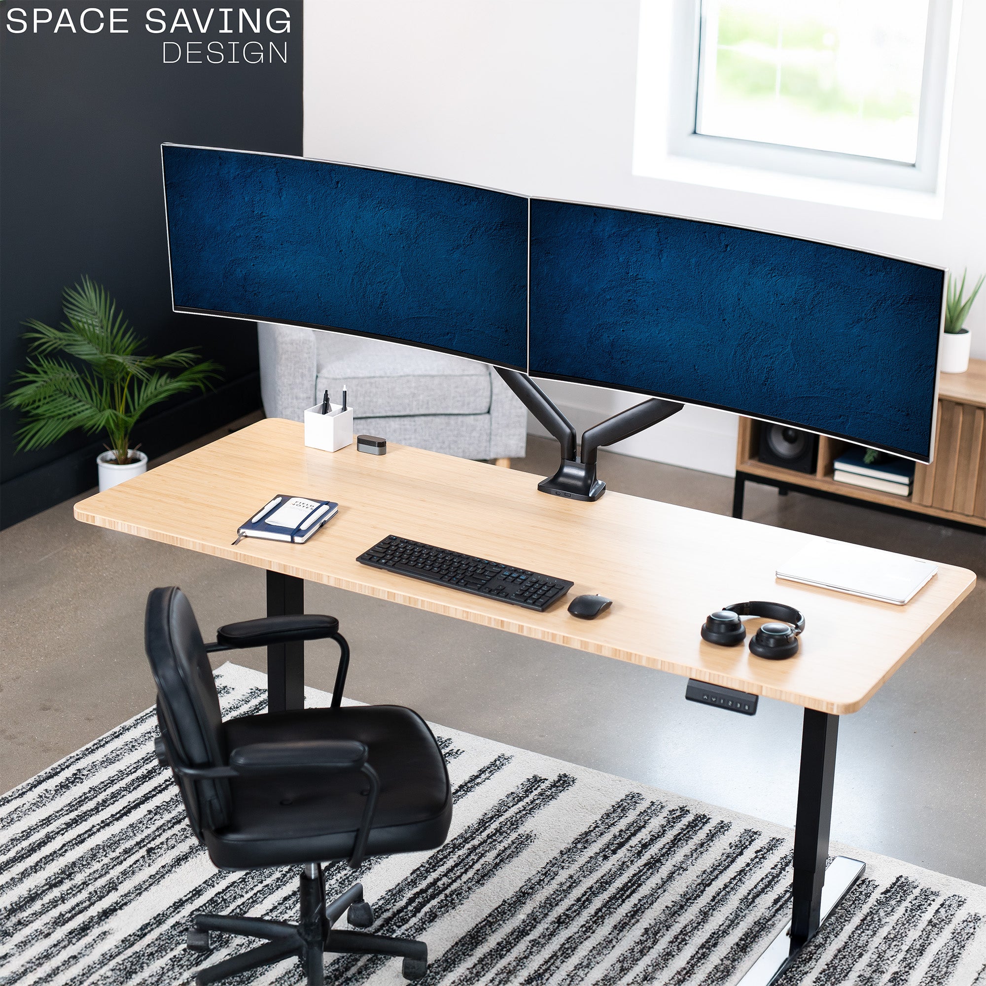 A dual ultrawide monitor desk mount with pneumatic arms displaying space saving design.