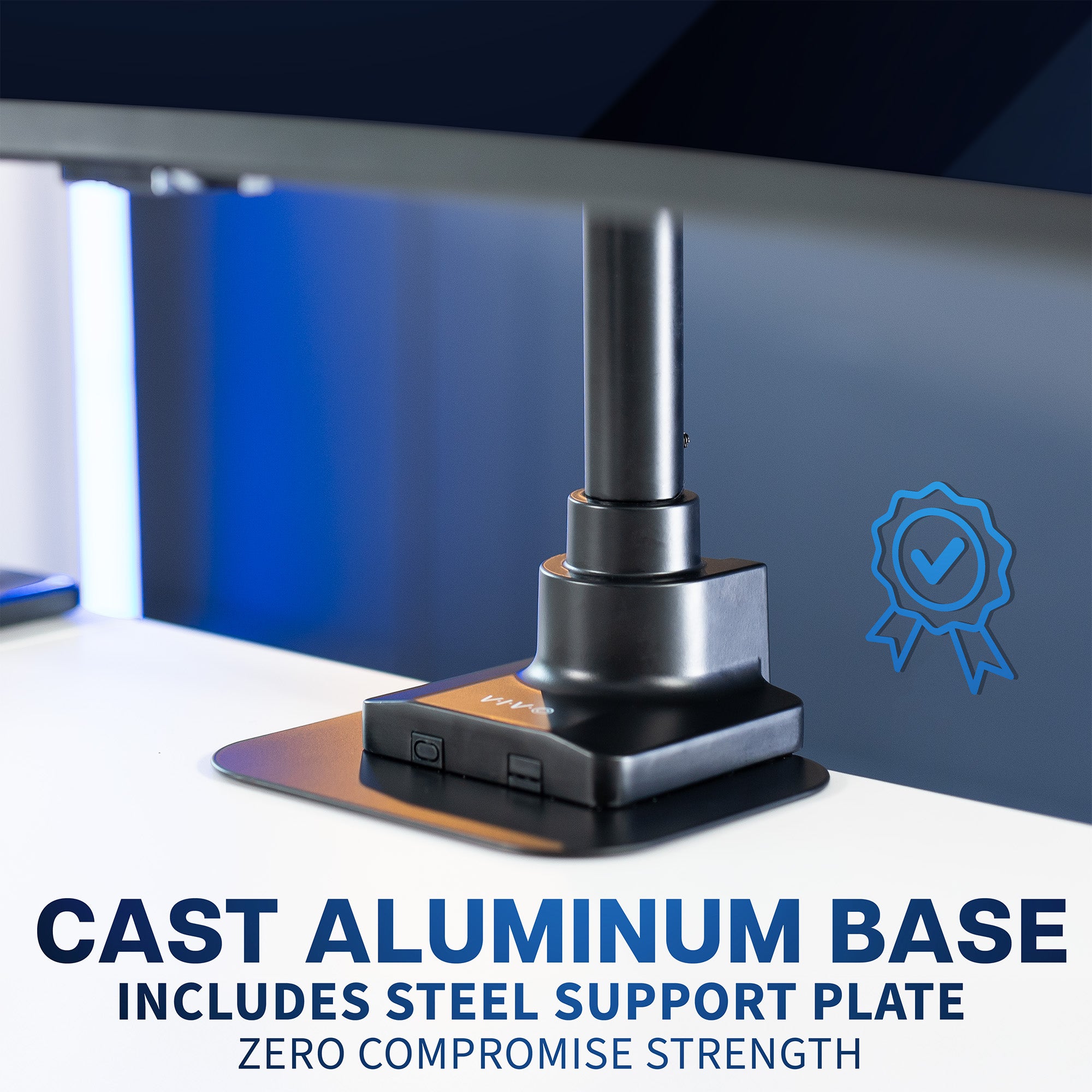 Base of monitor stand with steel support plate on a blurred office desk background