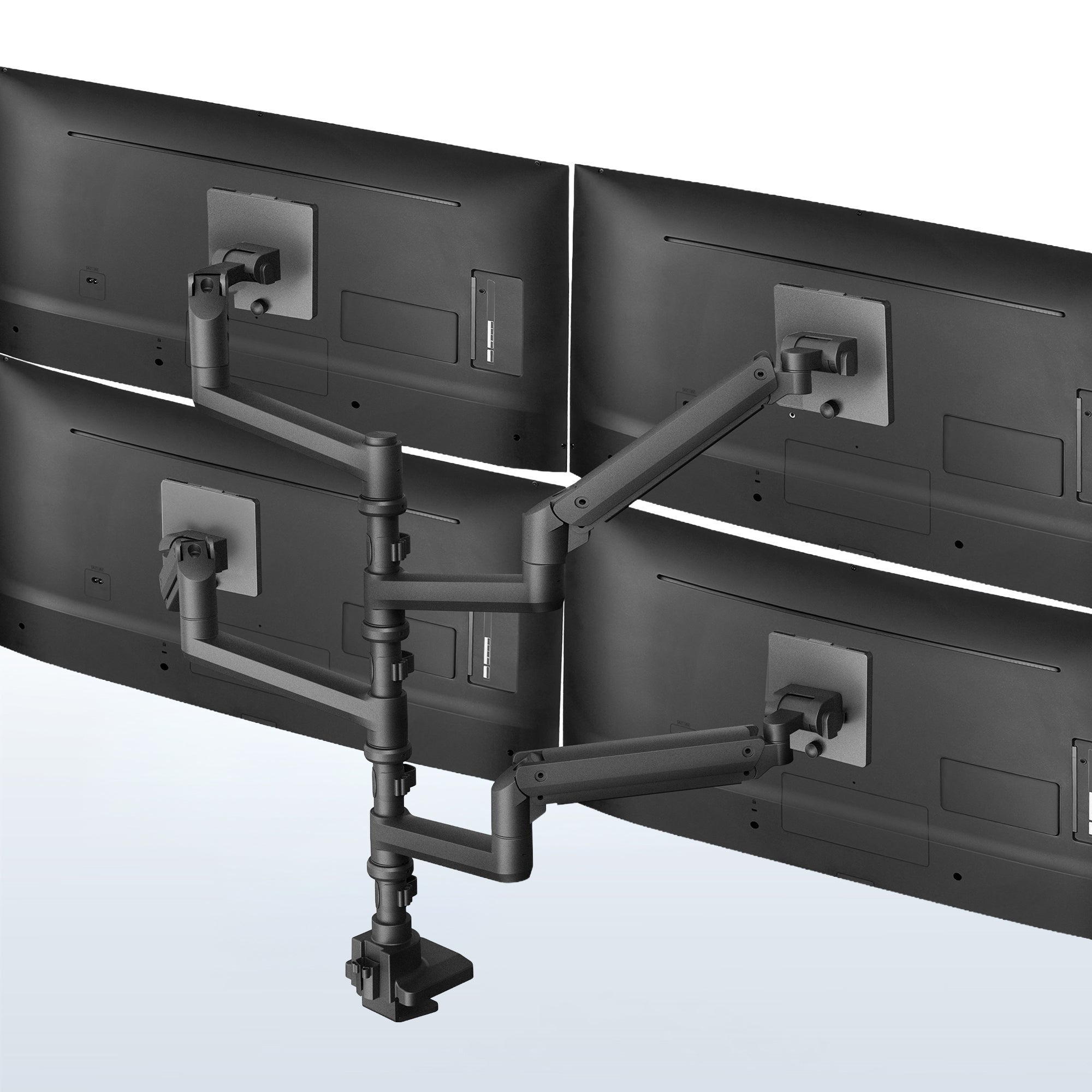 A black pneumatic arm quad ultrawide monitor desk mount with four screens attached to it.