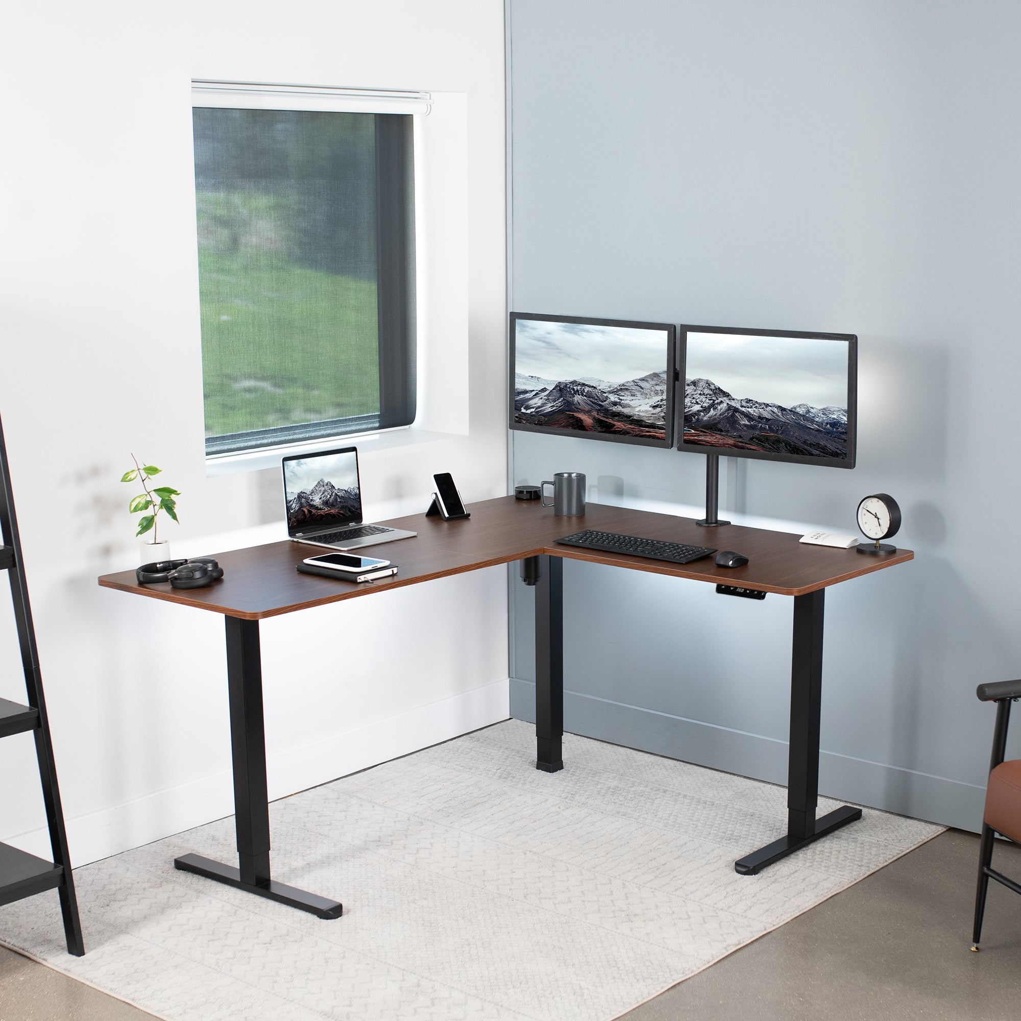 Electric heavy-duty corner desk workstation for modern office workspaces.