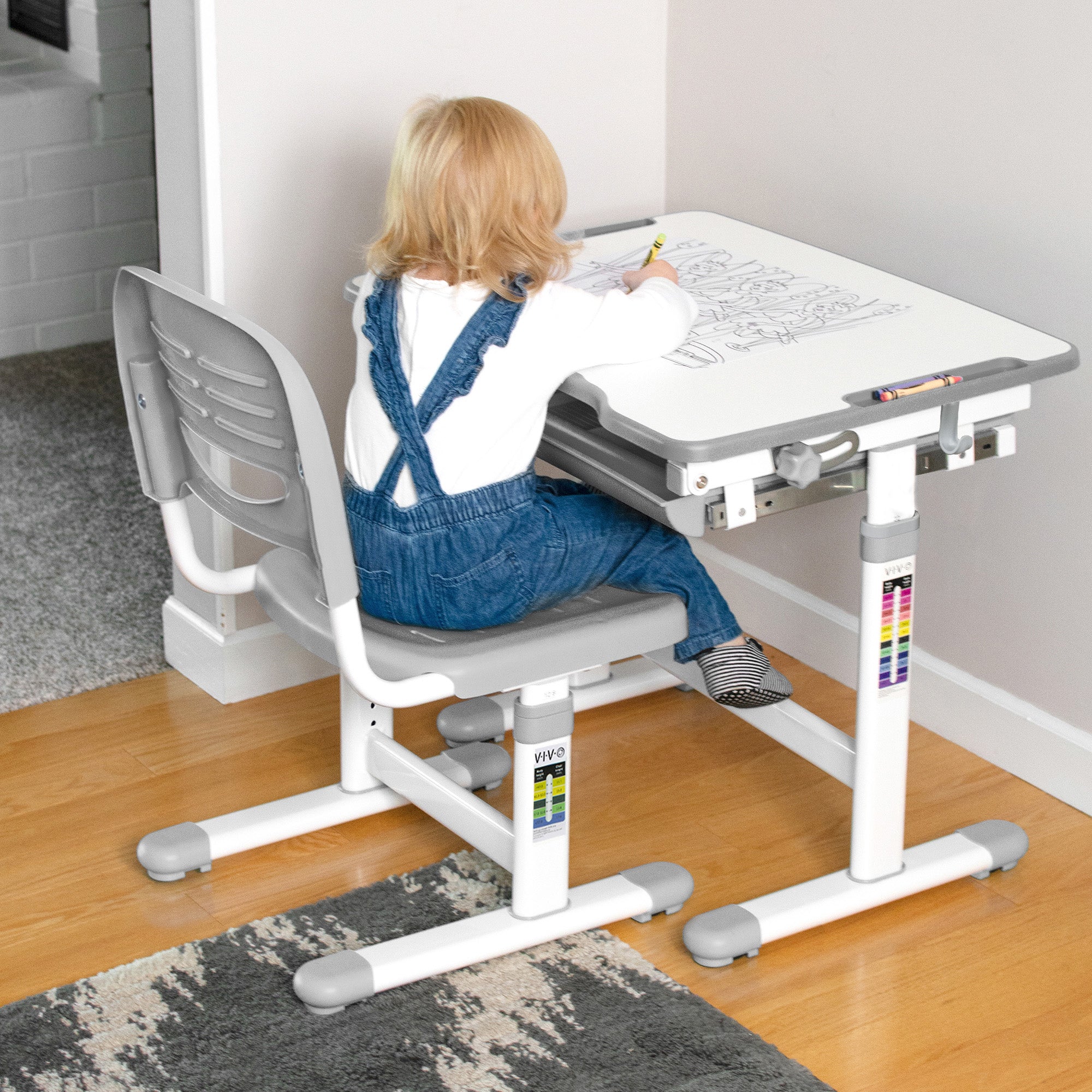 At-home children's desk and chair being used for coloring.