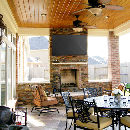 Protective flat screen TV cover in an outdoor patio area.