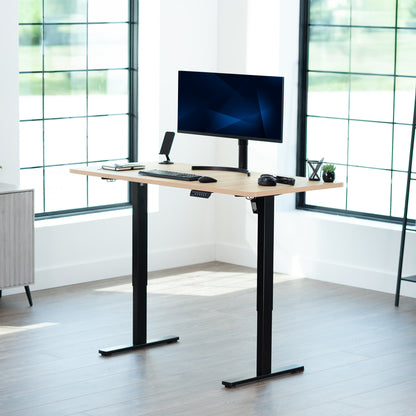 Sturdy ergonomic sit or stand active desk workstation with adjustable height using smart control panel.