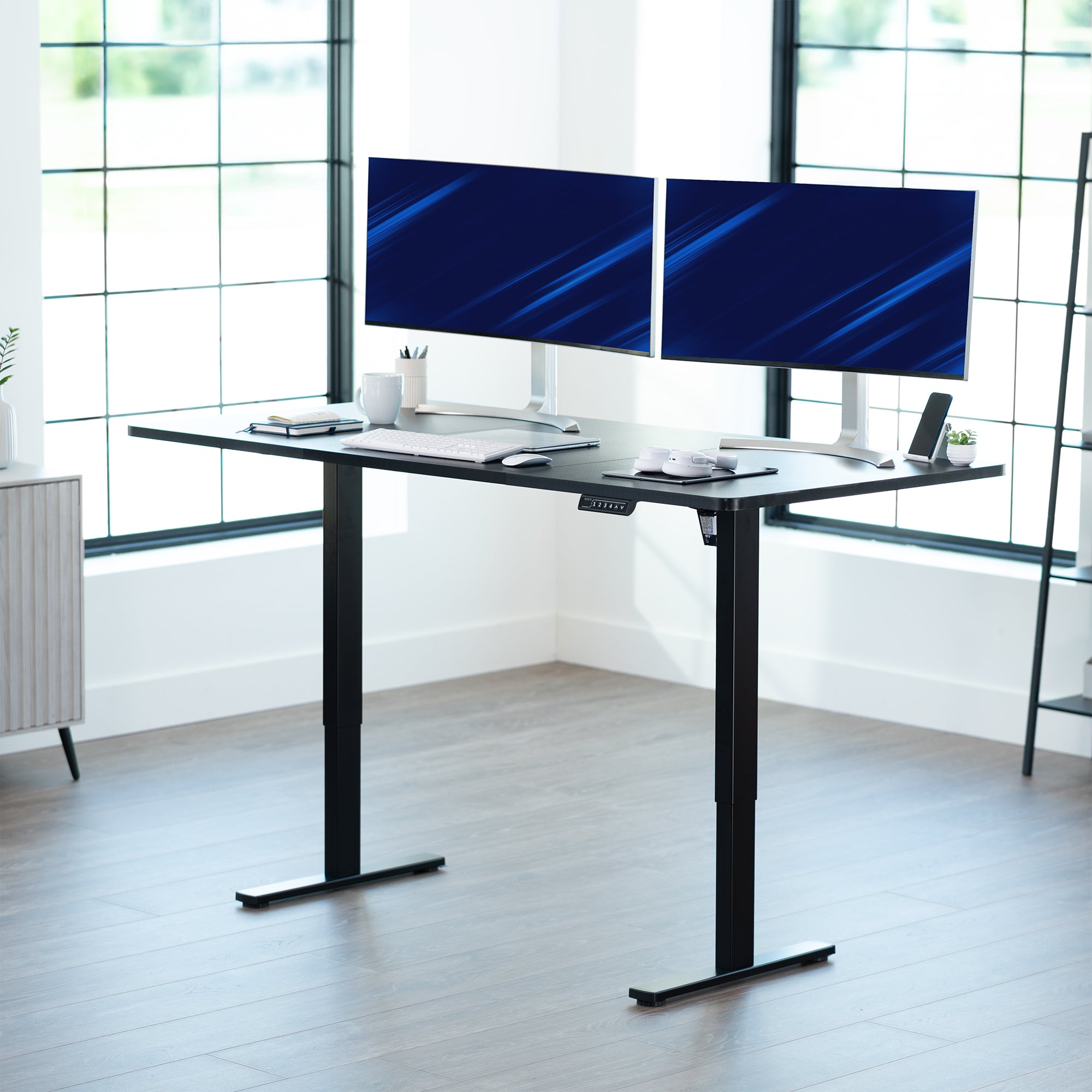 Large sturdy sit or stand modern desk with electric height adjustment options.