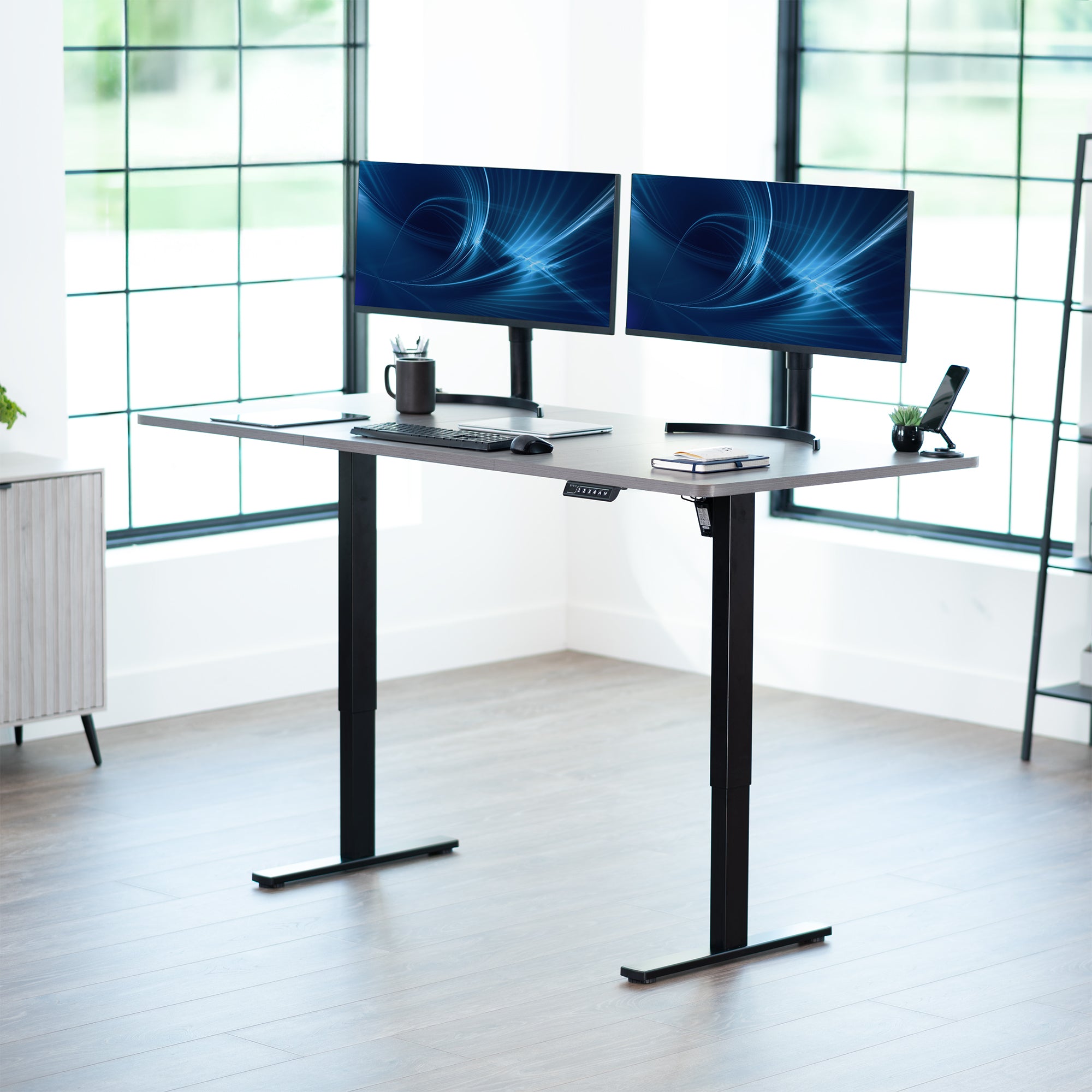 Large sturdy sit or stand modern desk with electric height adjustment options.