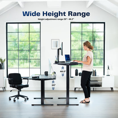 Woman using a standing desk with height adjustment range displayed