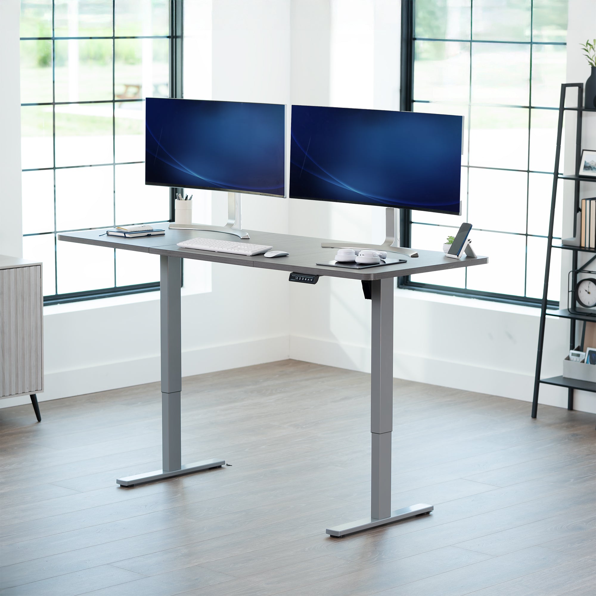 Large sturdy sit or stand modern desk with electric height adjustment options.