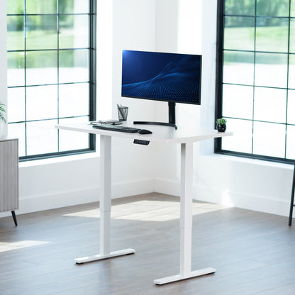 Sturdy ergonomic sit or stand active desk workstation with adjustable height using smart control panel.