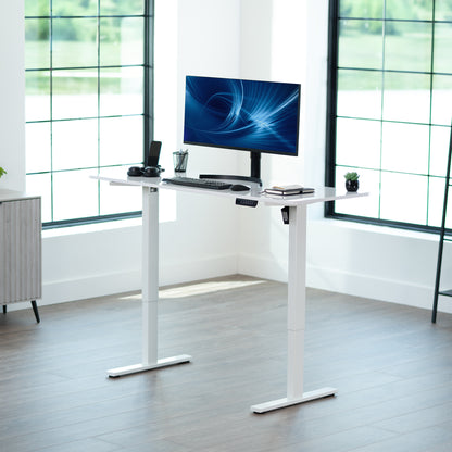 Sturdy ergonomic sit or stand active desk workstation with adjustable height using smart control panel.