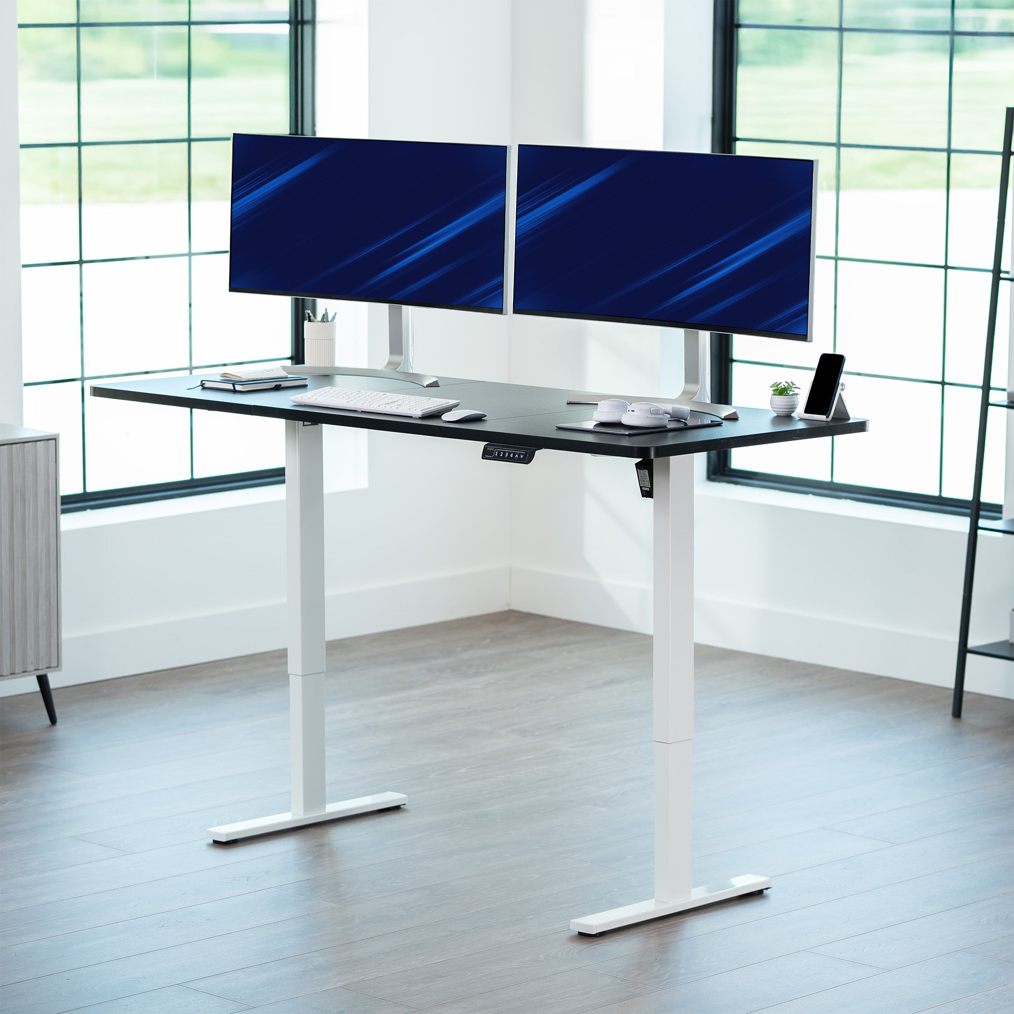 Large sturdy sit or stand modern desk with electric height adjustment options.