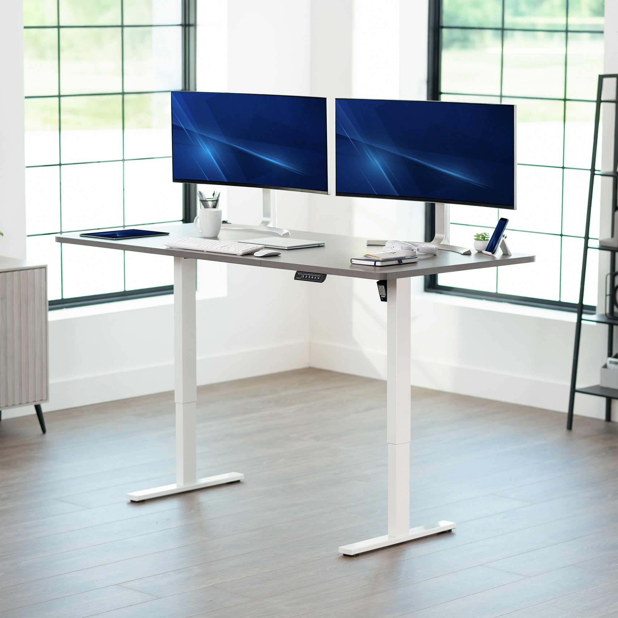 Large sturdy sit or stand modern desk with electric height adjustment options.