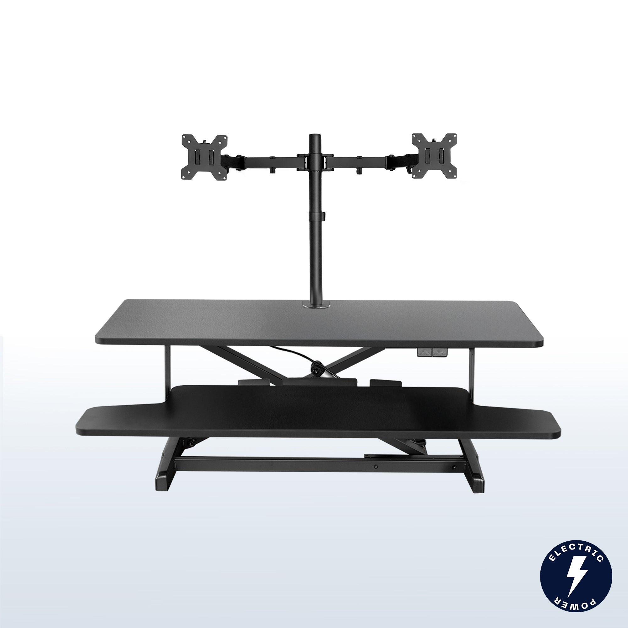 Sit to stand desk riser and dual monitor mount with electric height adjustment.