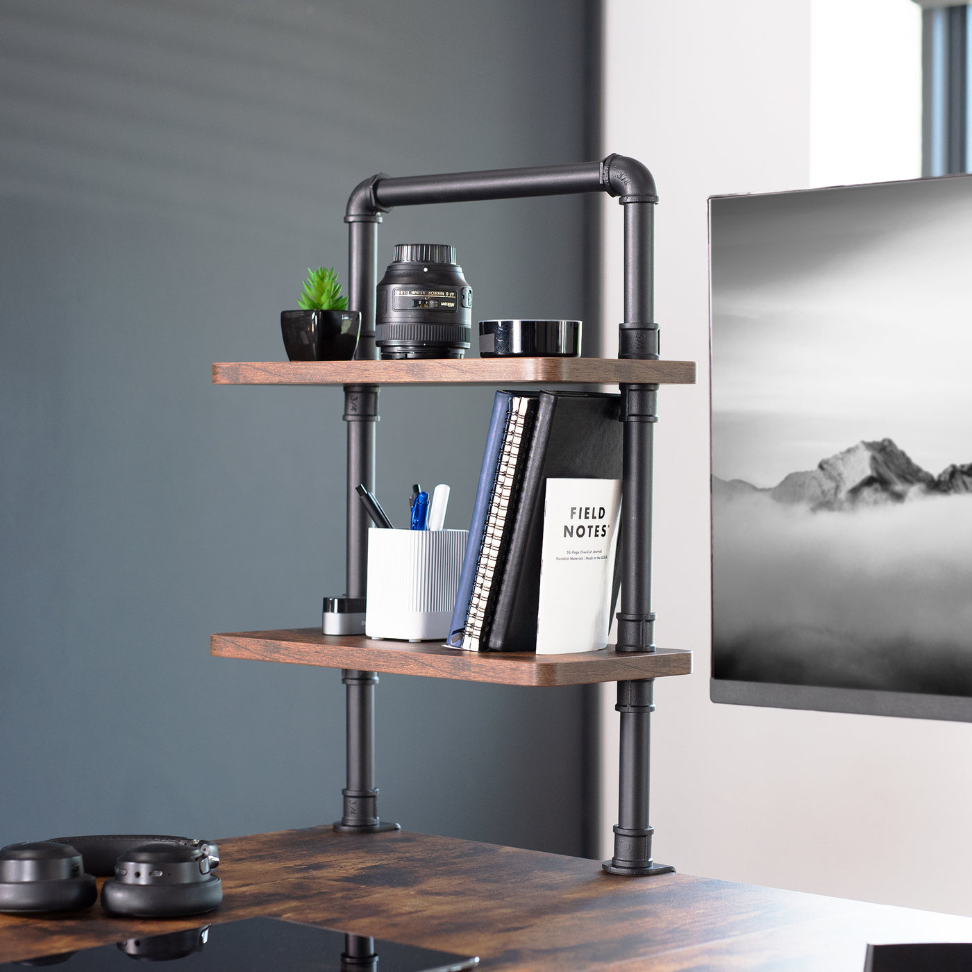 Clamp-on Industrial Pipe Shelves secure to your office desk and create dual level storage for clearing workspace clutter.