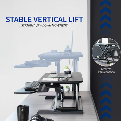 Sturdy height adjustable 2-tiered desk riser for ergonomic office workstation.