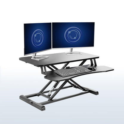 Sturdy height adjustable 2-tiered desk riser for ergonomic office workstation in  office setting. 
