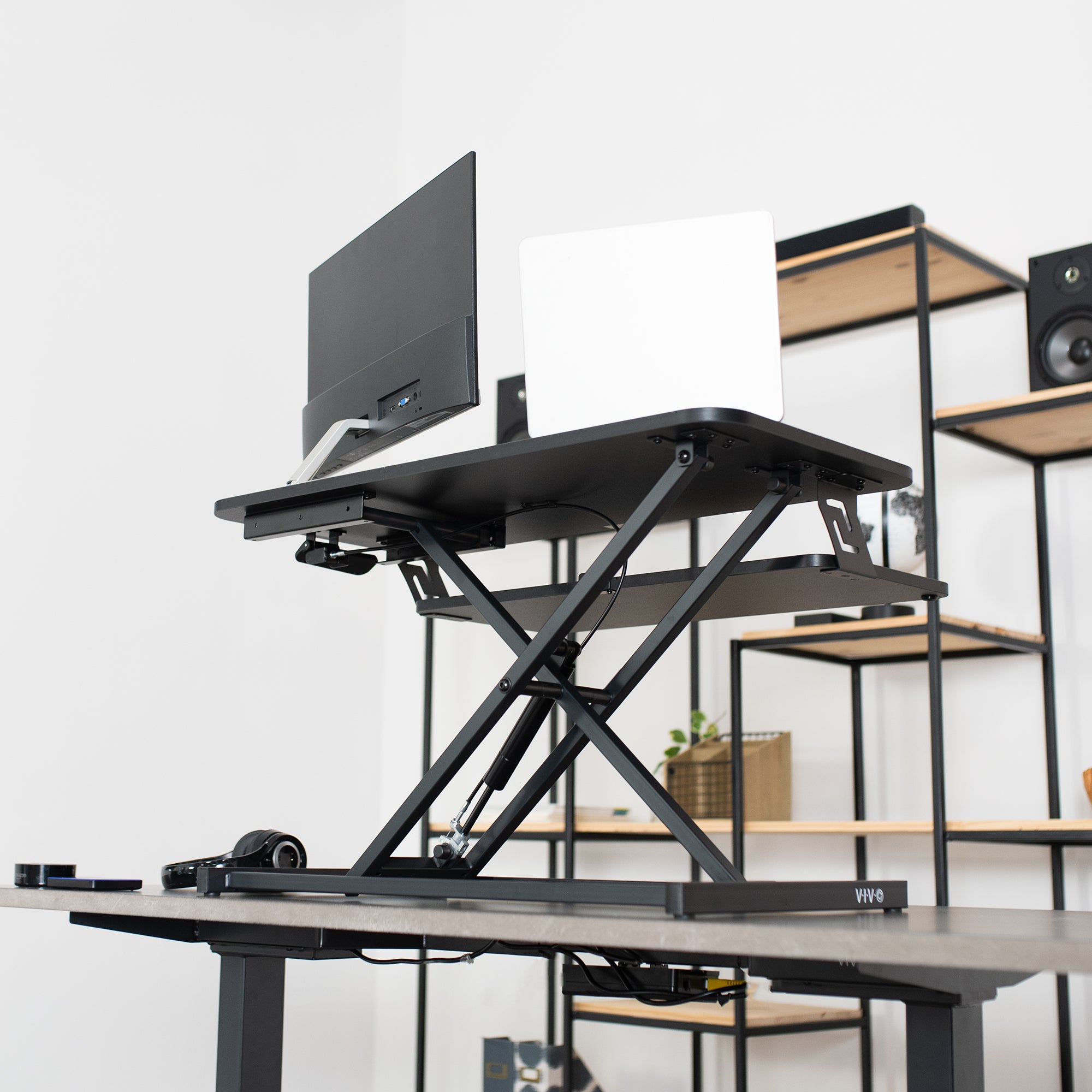 Heavy-duty height adjustable desk converter monitor riser with 2 tiers.