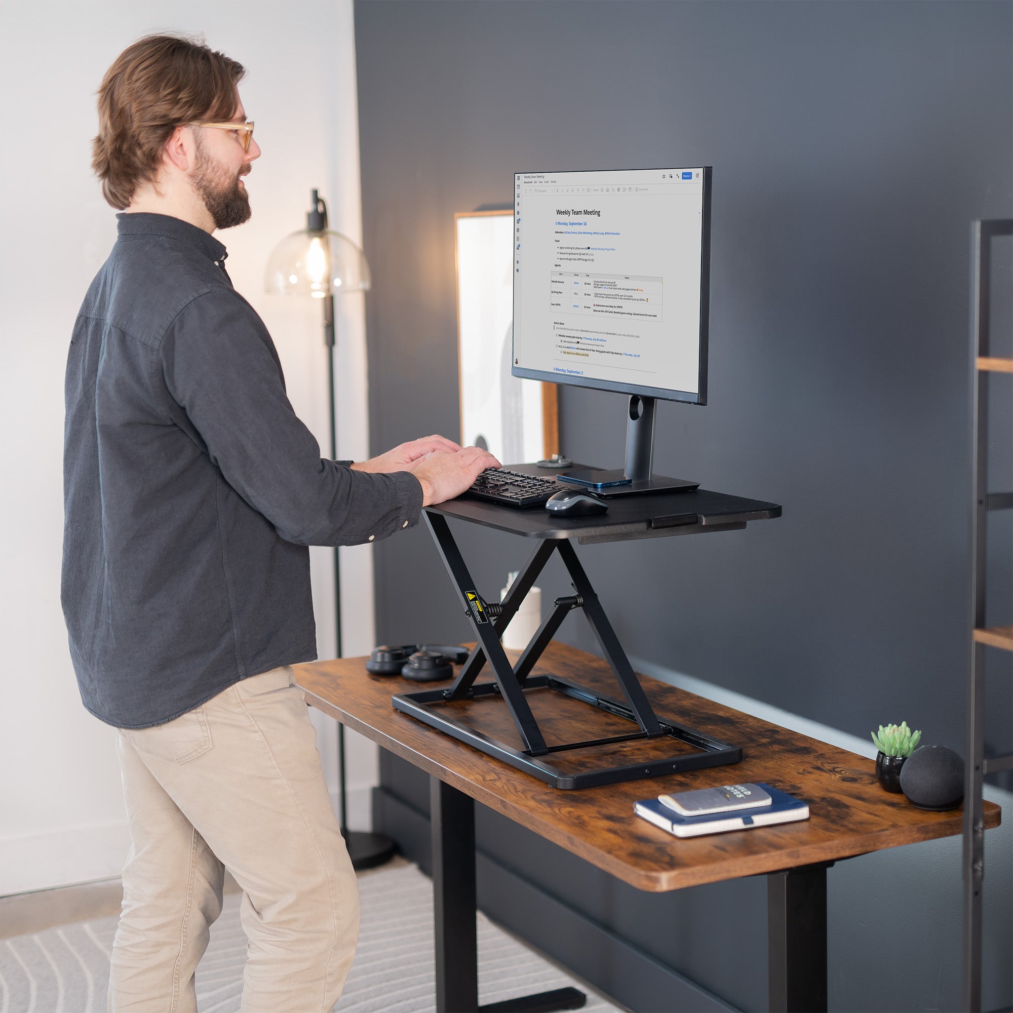 Heavy-duty height adjustable desk converter monitor riser.