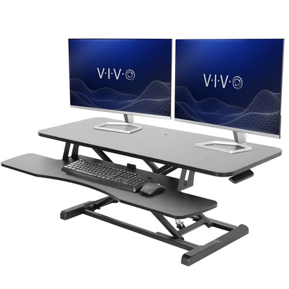Sturdy height adjustable 2-tiered desk riser for ergonomic office workstation.