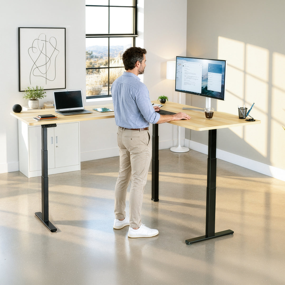 Model standing at a desk in a home office space, black desk frame with light wood top