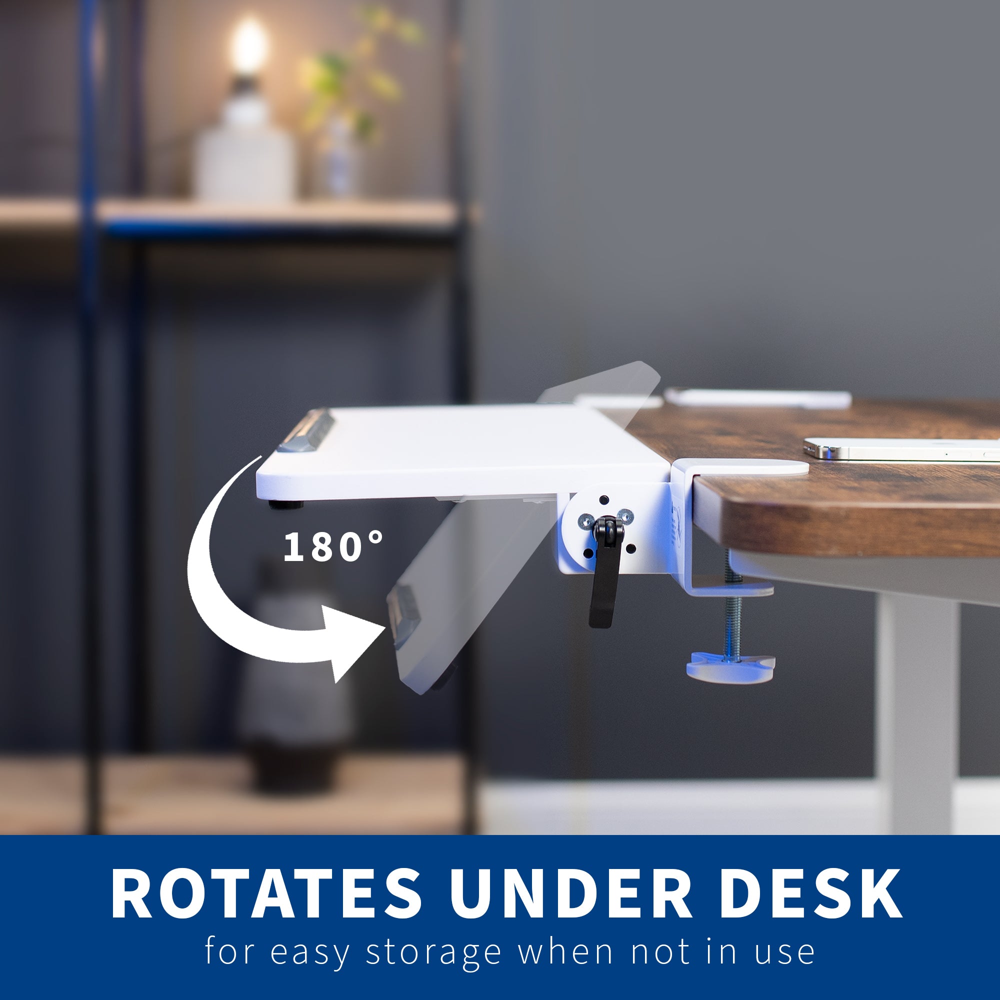 Desk with a rotating component for easy storage, set in a home office setting.